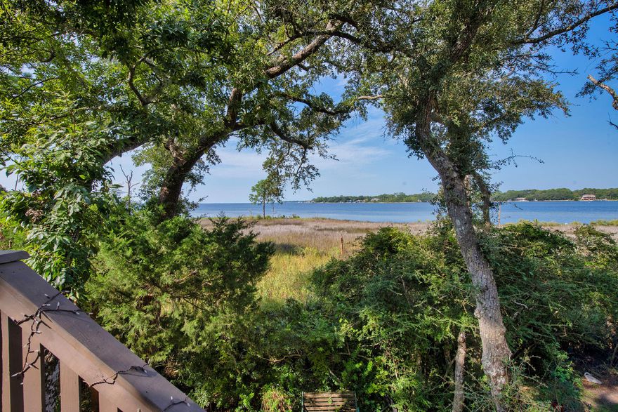 This end-unit townhome offers stunning water views from multiple levels and extra guest parking conveniently located right out front.The first floor welcomes you with LVP flooring, an updated half bath, a storage closet, and built-in cabinetry. The cozy living area features a gas fireplace and opens to a private deck overlooking the baya"perfect for relaxing or entertaining. Upstairs, the spacious kitchen is designed for both function and style with pull-out shelves, two pantries, an island with butcher block top, and granite countertops. The dining area and adjoining sitting space offer more breathtaking bay views, along with roll-out windows, built-in shelving, and durable LVP flooring.
A loft and guest bedroom with vaulted ceilings are located on the next level, while the top floor is dedicated to the primary suite. Here, you'll enjoy an en-suite bath, a large loft, and gorgeous bay views right from your bedroom.
This one-of-a-kind home combines thoughtful updates, multiple living spaces, and unbeatable waterfront scenery! 
The garage can hold 2 vehicles parked back to back or used as a flex space; and has an additional back area converted into a mini flex space with air! The possibilities for this home are endless! 
Schedule a showing today! 