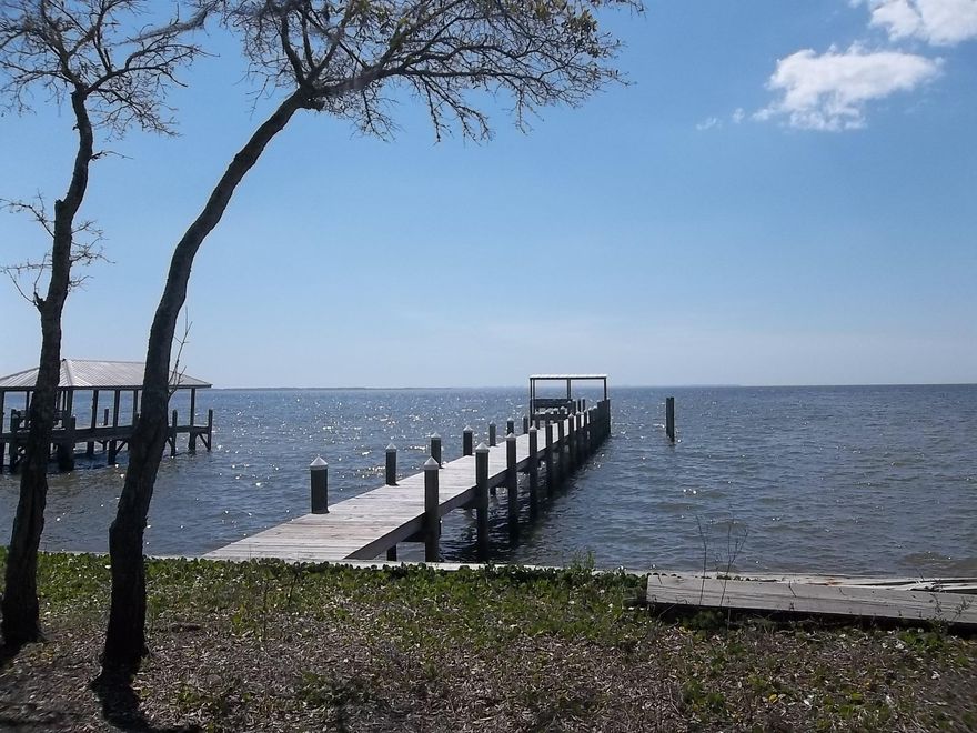 DELIGHTFUL BAYFRONT! Seawall and New DOCK already in place. Bring your boat, fishing rod & crab traps. Build your new home to maximize the extensive Bay views. Sunsets from Bay Harbour are Magnificent Bay Harbour has a mandatory HOA and all home plans will need to be approved by the ARC. Minimum 2,000 sq ft of heated & cooled space is required for all bayfront homes. Bay Harbour features a separate storage area for owners, lighted streets, 175 acre nature preserve, tennis court, boardwalk to the Bay and more