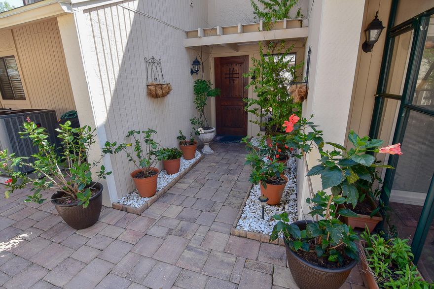 Beautiful ground floor master suite townhome! Boasting a spacious and inviting paver patio, , a greenhouse room and a Florida room, this three bedroom, three bath townhome combines indoor and outdoor areas for everyone. Large open great room with a soaring ceiling and a staircase leading to two bedrooms, a full bath and a loft area with plenty of usable space including a built in desk and storage. Updated kitchen with new appliances, new HVAC and 4 year old roof maintained by the HOA. This home is nestled in a quiet, serene development close to the tennis center and the rest of the fantastic amenities of Bluewater Bay. Carefree living and wonderful outdoor living space!