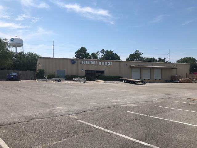 15,832 sf fully air conditioned industrial space with showroom, four loading docks, one drive up ramp and fenced in yard.
