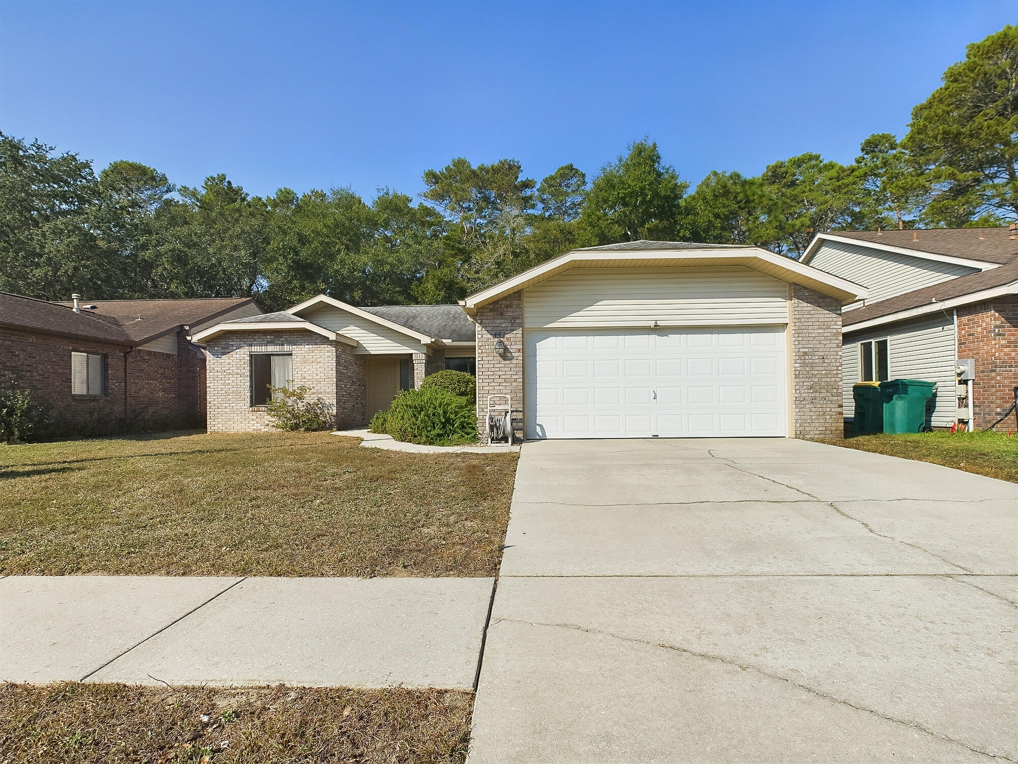 Discover this sweet 3-bedroom, 2-bathroom home in the welcoming Cedar Ridge community! Thoughtfully designed with a split bedroom floor plan, this well-kept and incredibly clean residence boasts an abundance of natural light from two skylights and features ceiling fans in each bedroom for added comfort. The cozy living area centers around a gas fireplace, and the 10x16 screened porch offers a serene spot to relax or entertain. Additional highlights include an indoor laundry room, an all-brick exterior, and a privacy-fenced backyard. Don't miss the chance to make this home your own and enjoy all the benefits of this fantastic location!