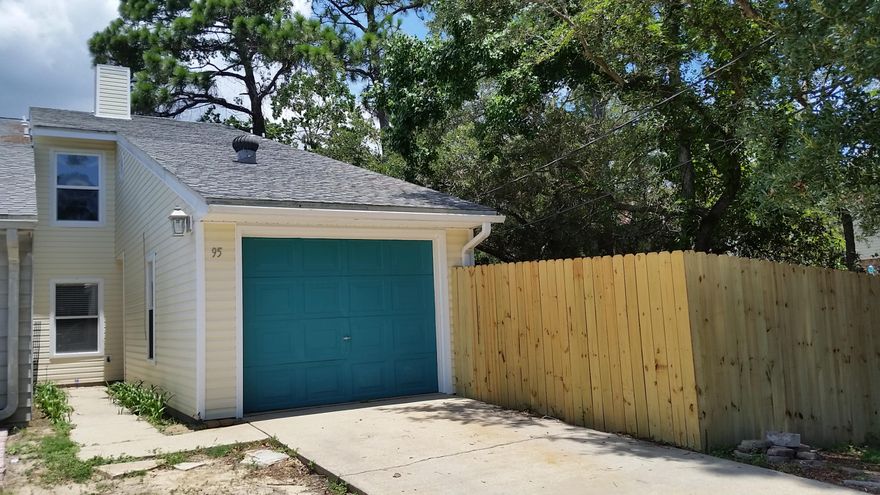 Great end unit with garage and nice size fenced yard close to Eglin AFB. You'll be impressed with the open and spacious feeling and pretty wood staircase as the focal point. The bonus room can be used as a 3rd bedroom. Seller has done a lot of updating to include all new: interior paint, carpet, lighting, flooring in full baths and privacy fence. Home has vinyl siding for easy maintenance. Windows and kitchen renovation to include cabinets, stainless appliances, travertine tile counters and backsplash were done in 2009. The seller expanded the kitchen by enclosing the patio and added french doors to access the nice wood deck. New dimensional shingle roof installed in 2005. Neutral 16'' tile throughout the downstairs and new carpet upstairs. Move in ready for new owner.