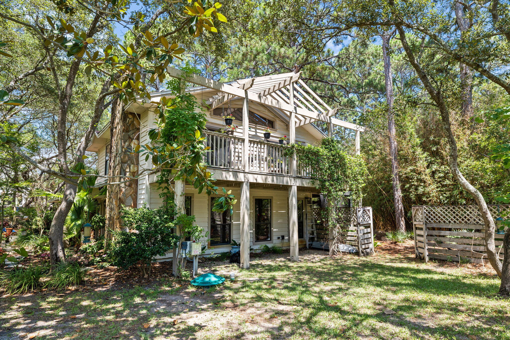 Welcome to this remarkable property, offering the best of both worlds--a charming home and expansive land located just south of 30A. Situated outside the coastal dune area, this premium parcel presents a truly unique opportunity. Property has an adorable home that can be lived in while plans are being finalized for expansion. Currently property boasts a delightful three-bedroom home that exudes character and comfort. Originally built in 1986 and thoughtfully remodeled in 2000, it seamlessly blends a touch of nostalgia with modern updates. The home has stood the test of time and awaits new owner's vision. The true allure lies in the vast land surrounding the home. Boasting three-quarters of an acre, this spacious lot provides abundant space, privacy, and incredible