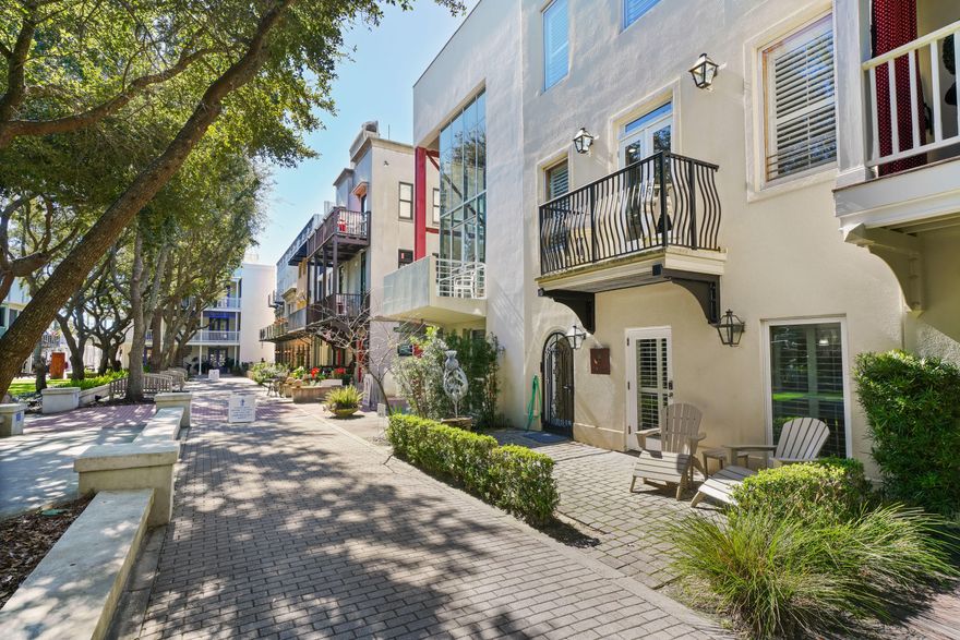 BOTHY- Located in Ruskin Place, Seaside's prized Artist's Colony, is this exceptional townhome! Reminiscent of Jackson Square in New Orleans, these townhomes surround a beautiful landscaped park lined with bench seating shaded under mature oak trees. Bothy's three levels offer a ground floor comprised of a self-contained apartment with living room, full kitchen, master bedroom, bunks and two baths. Lock off from the upper floors and rent separately or combine with the upper levels. A private entrance takes you to the second level great room. Abundant light streams throughout the open floor plan. The inviting & spacious living area with its high ceiling & wet bar is decorated to reflect the casual and comfortable beach lifestyle. Off the living area is a 21' x 10' terrace equipped with