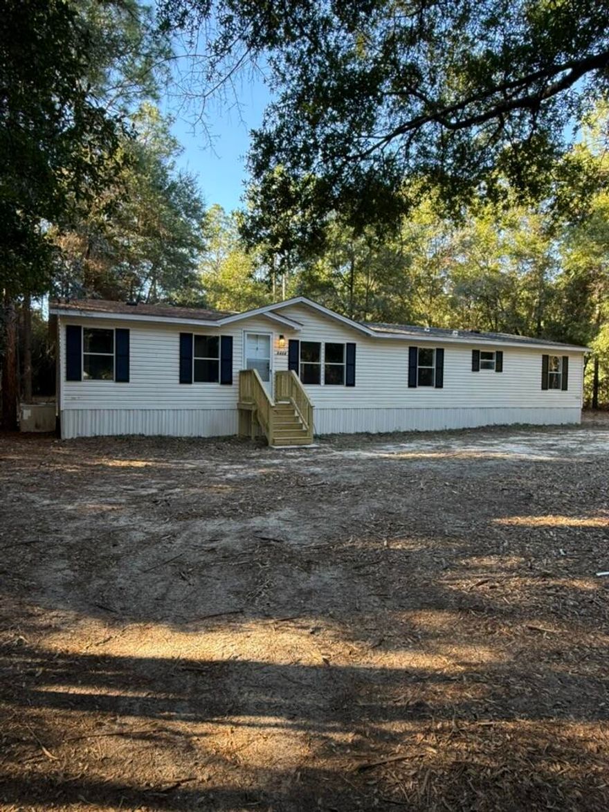 Welcome to this beautifully updated 3 bedroom, 2 bathroom mobile home on a 1-acre lot. This home features a bright and open floor plan with brand new flooring, fresh interior paint, and updated fixtures throughout. The kitchen is equipped with new appliances and offers ample cabinet space, making it both stylish and functional. All bedrooms are well-sized with comfortable layouts and natural light.Enjoy peaceful country living while still being just a short drive to nearby conveniences. Whether you're looking for space for a garden, outdoor activities, or future additions, this property offers endless possibility. Move-in ready and waiting for its next owner--don't miss this one!