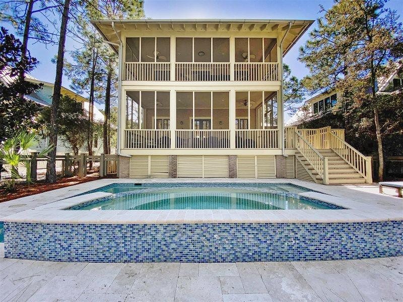 Located in Phase II of Watercolor, this home offers the ultimate in indoor and outdoor living featuring 4 Bedrooms and 4 baths, and almost 1,000 square feet of balconies and screened porches. This home borders a natural preserve and features a large private pool. The main floor features a two story foyer leading to a huge open living room, dining room and kitchen that flows to a huge screen porch overlooking the oversized pool and preserve area behind the house. There's also a queen bedroom with shared bathroom, washer and dryer and a wet bar area. The second floor features a king sized bedroom with private bath, a bunk room with 4 twin beds and private bath and a king size master suite with sitting area and spa tub. Just off the master suite is another large screen porch with hammock