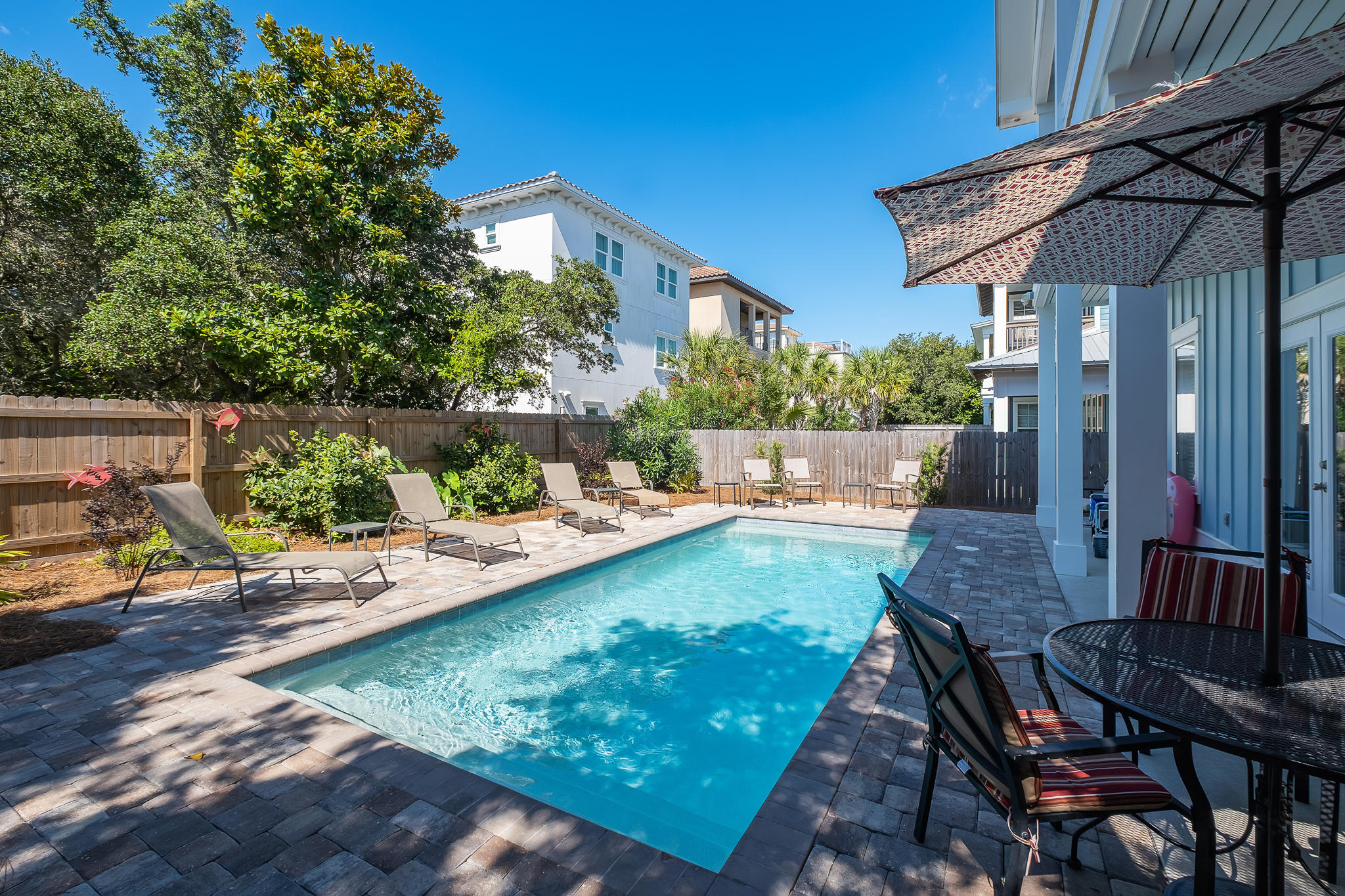 Priced to sell! This 6 bedroom, 6 bath home is the vacation rental home you have been waiting for. Located in the heart of Frangista Beach with no HOA fees and a private heated pool. A short walk to the gated and private beach access. This beautiful beach abode was newly built in 2018 and offers 570 square feet of porches to enjoy the smell of the salt air as you sip your morning coffee or afternoon cocktail! The home is freshly painted and is being sold fully furnished with only a few exceptions. The open living area is light and bright and makes the perfect space for family and friends to gather. The kitchen is complete with stainless steel appliances and a breakfast bar.
