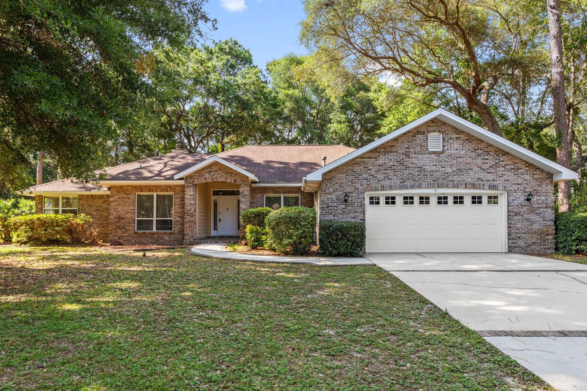 Nestled in the sought-after Rocky Bayou community, this inviting single-story brick home offers comfort, space, and timeless charm. Step through the welcoming entryway into a large formal dining room filled with natural light from a picture window. The cozy living area features vaulted ceilings and a warm fireplace with a classic wood mantle--perfect for relaxing or entertaining. The spacious eat-in kitchen is a chef's dream with upgraded maple cabinetry, stone countertops, sleek black appliances, a gas range, and built-ins for extra storage. A walk-in pantry and a butler's pantry--complete with a second refrigerator--add convenience and function. All bedrooms are carpeted and feature ceiling fans. The primary suite boasts a tray ceiling, French doors opening to the private backyard, a large walk-in closet, and a luxurious en suite bath with double vanity, soaking tub, and separate walk-in shower. The additional bedrooms are connected by a Jack-and-Jill bath, each with its own expansive vanity and a shared toilet area. A third full bathroom includes a walk-in shower and is conveniently located near the laundry room with extra storage. Enjoy the outdoors year-round from the screened-in lanai overlooking a serene, private backyard with mature trees. A two-car garage completes the home's practical layout.