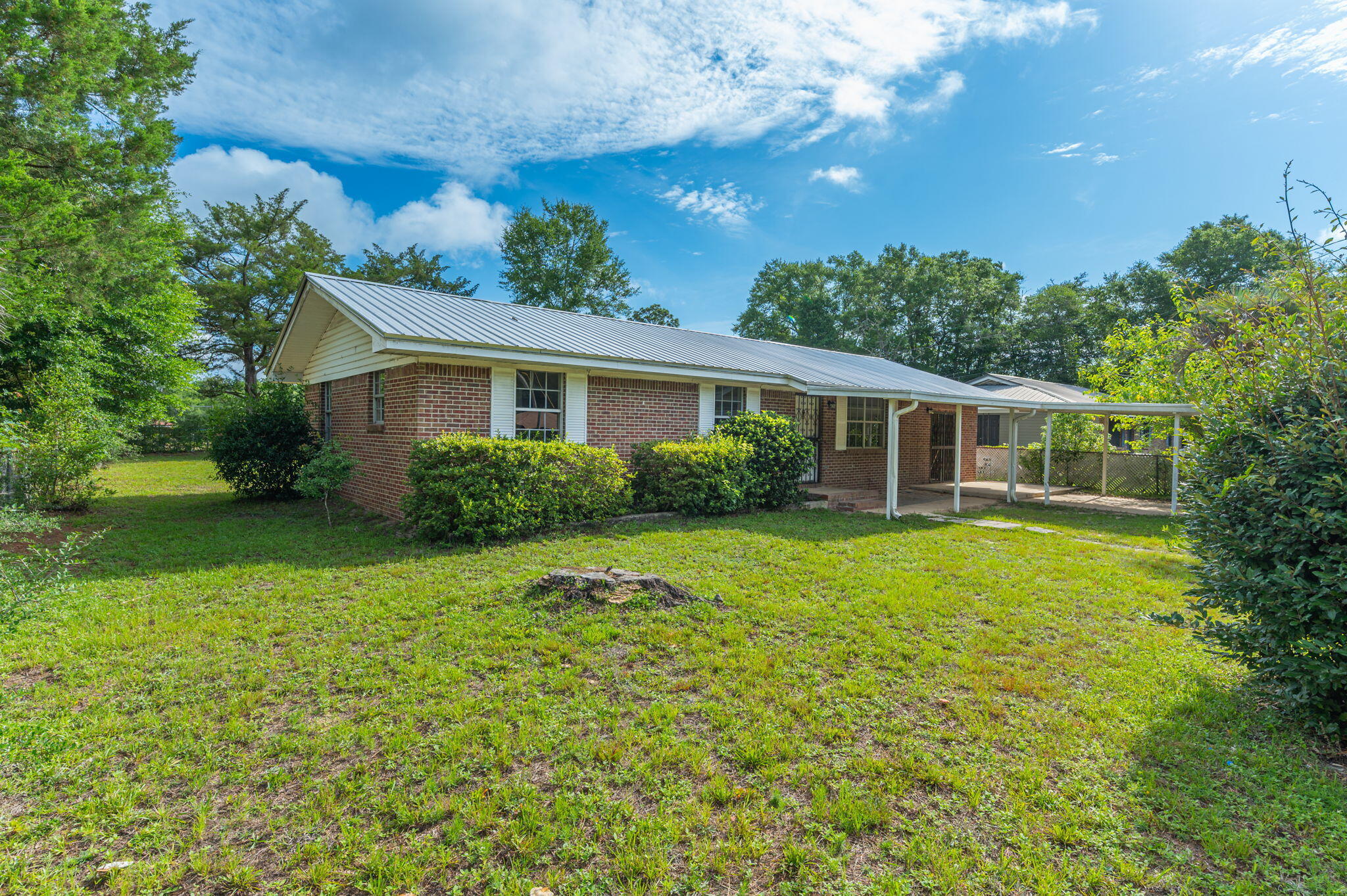 This well-maintained 3-bedroom, 1-bath home in the heart of DeFuniak Springs offers a versatile bonus room that can serve as a second living area, home office, playroom, or even a fourth bedroom to suit your needs. Enjoy the privacy of a fully fenced yard--perfect for children or pets--as well as the convenience of a covered carport. Located just minutes from schools, shopping, and local amenities, this home combines comfort with accessibility. Rental requirements include a minimum credit score of 600 for all adult occupants, at least one year of consistent employment, and a monthly household income of at least 2.5 times the rent amount. Application required including credit report & background screening.
