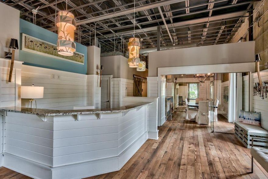 This is a beautiful designed and custom built office on 30A.  Located near Eastern Lake ad adjacent to Watersound West Beach.  There is a coastal flare in the design and the wood floors and desks created from wood of an old Tennessee barn give the space a unique appeal.   The lighting combined with the exposed ceilings  and 12 windows give this office a great atmosphere. Featuring glass enclosed private offices along, with six spacious 'flex'' spaces and a front desk reception area and glass enclosed conference room.  This is the office everyone will like.
