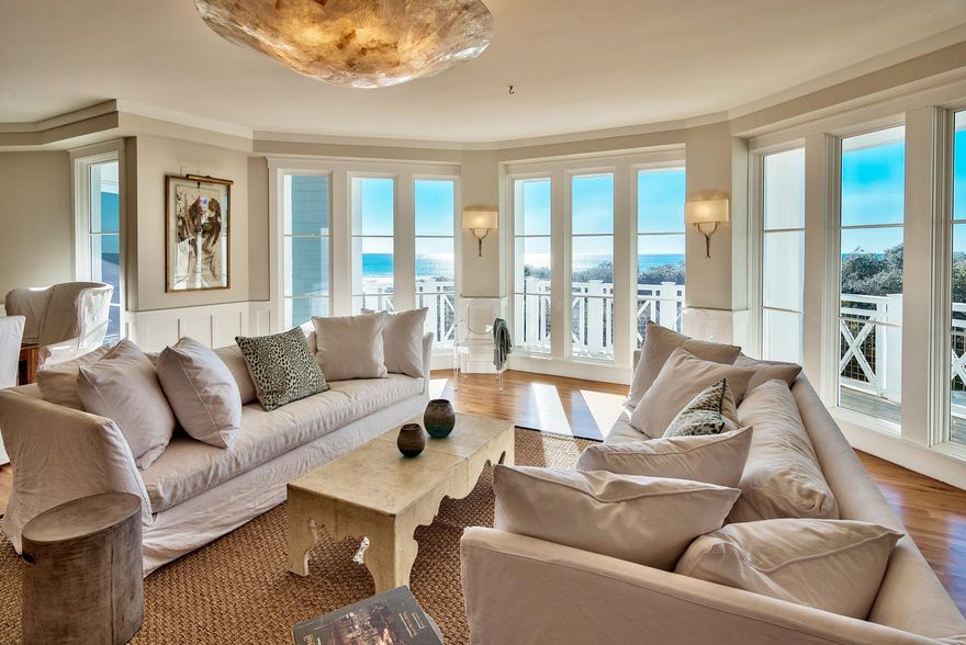 This residence is nothing short of spectacular and is the BEST PRICED Crossings condo above the first floor. From the moment you walk through the door the ocean views will take your breath away. Its location in the ''C'' building closest to the gulf means you see only natural foliage and the postcard worthy beach from all angles of the expansive, open floorpan. Featuring magazine worthy decor, the unit truly feels more like a stand alone home than a condominium. This single-level, second-floor location is the best of both worlds. You get phenomenal views, but with minimal stairs! The residence has beautiful hardwood and travertine tile floors throughout, and an open gourmet kitchen with stainless appliances and a Viking range. The expansive porch takes full advantage of its corner locati