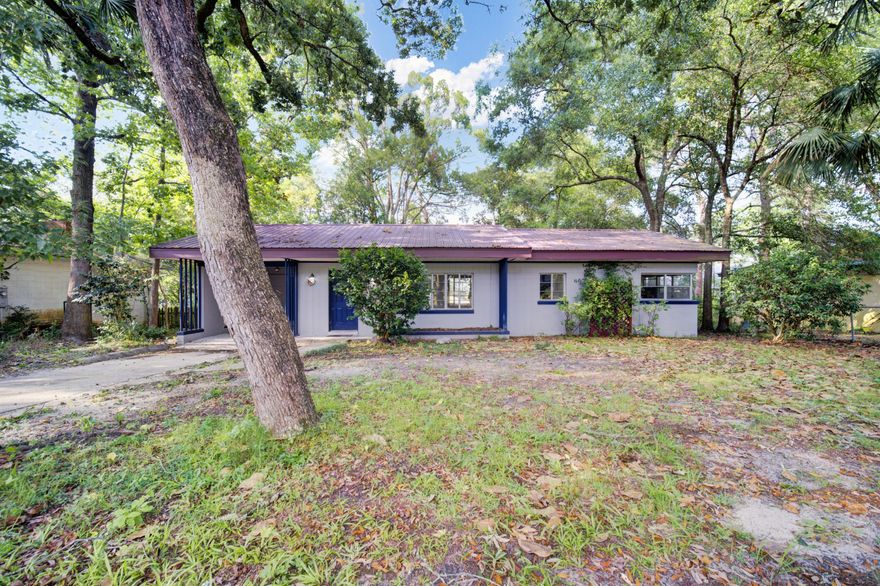 WATER VIEW!! Welcome to this Old Florida cottage in the heart of Valparaiso, where the perfect home awaits you! Nestled in a sought-after location, this charming property is ideally situated near Boggy Bayou, excellent schools, multiple parks and Eglin Air Force Base. Priced under $300,000, this home presents an incredible opportunity as both a rental investment and a starter home for a growing family.