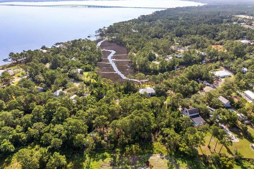 BAY ACCESS WATERFRONT LOT with Assignable Dock Permit   Stunning BAY VIEWS and direct NAVIGABLE access to the Choctawhatchee Bay from this prime waterfront lot for boating enthusiasts in a private bay front community. Approximately 6,000 sq. ft. of, dry, well drained contiguous upland on a newly paved road. All utilities - electricity, public water and sewer, natural gas and high-speed fiber optic cable available. Located just one mile from US Highway 331 and easy access to nearby beaches, shopping, dining and entertainment. An environmental survey, including topography and wetlands delineation, is available. Residential construction may require a Minor Development Order.
