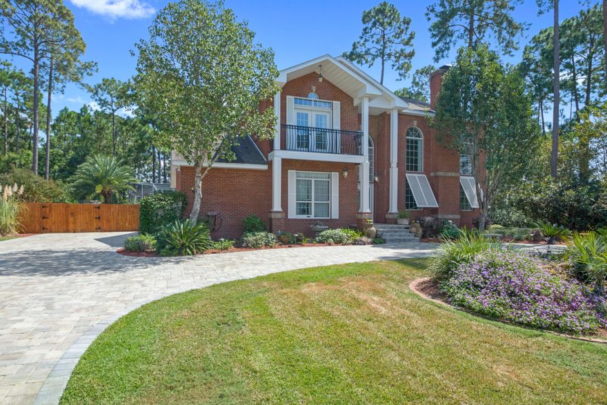 This stately, colonial-style all-brick home with wrap-around porches impresses long before you step inside. You are greeted by the grand oak staircase which completes the living room with 20' ceilings. The kitchen features granite countertops, large island, custom cabinets, pull out pantry, and a lazy susan. Also on the first floor is a formal dining room and a breakfast area. The split floor plan includes a downstairs master suite with a master bath featuring a large jacuzzi tub, two sinks, a separate shower, a walk in closet, and 2 additional closets! Open the french door access from the master suite to the 18 x 36 heated pool and whirlpool spa. The pool is complete with a screened enclosure and outside shower, a perfect spot for entertaining family and friends.