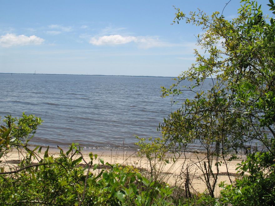 Bay-front lot with forever views overlooking the waters of the Choctawhatchee Bay. The shoreline is a sandy beach and the lot sits on a high bluff that offer both protection from storms and a superior vantage point. The lot is wooded with native hardwoods allowing for privacy and shade for your new Northwest Florida homesite.