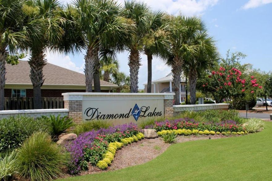 Diamond Lakes is a quiet community with a large pool, landscaping service, and centrally located in Destin. This large one level townhome boasts 1825 sq. ft. with 3 bedrooms, 2 bathrooms, 2 car garage, and a lovely screened in patio. This unit has tile throughout, high ceilings, and a large open living area with a gas fireplace and built-in shelving. The master suite features tray ceilings and a large walk-in closet. The kitchen has stainless appliances, corian countertops. The seller has removed the cabinets over the sink area allowing the space to feel more open. This unit is also just steps from the community pool! Its a MUST SEE!!