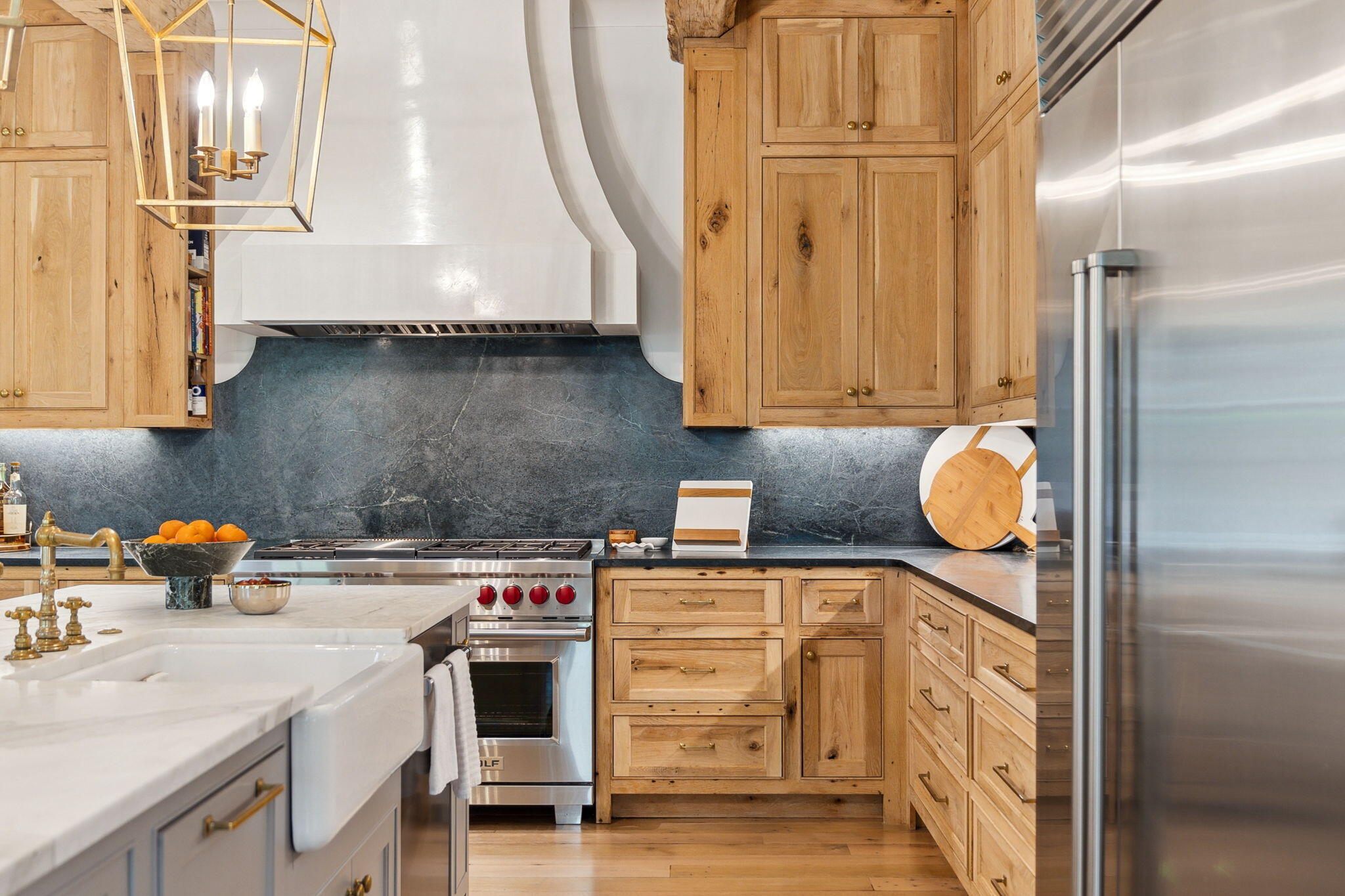 This stunning 7-bedroom, 9-bathroom estate on the south side of Rosemary Beach has been artistically transformed into a true architectural masterpiece. Taken down to the studs in 2019, the home has undergone a meticulous, top-to-bottom renovation and has continued to be thoughtfully enhanced over the past five years--resulting in the immaculate condition you see today. A seamless blend of timeless antique details and sophisticated modern upgrades creates an ambiance that is both luxurious and inviting. Recent improvements include a brand-new roof, a beautifully appointed outdoor summer kitchen, fresh interior and exterior paint, and a protective garage floor coating. Every detail has been curated to the highest standards, making this one of the most impressive and well-finished homes in the entire community. Pre-inspected for your peace of mind, this home is ready to welcome its next discerning owner.
The home showcases a masterfully redesigned floor plan appointed with reclaimed antique oak and designer finishes throughout.The chef's kitchen boasts beautiful artisan designed inset cabinets, Wolf and Sub-Zero appliances, soapstone counters, and a Calcutta gold marble island beneath reclaimed beams from a Kentucky tobacco barn
Venetian plaster, stone mantels, and brass fixtures elevate the interiors, while the spacious master retreat offers comfort and serenity just off the main living area.
Outside, a heated pool, copper lanterns, and bi-level carriage house complete the picture. Steps from the beach, this is refined coastal living at its finest.