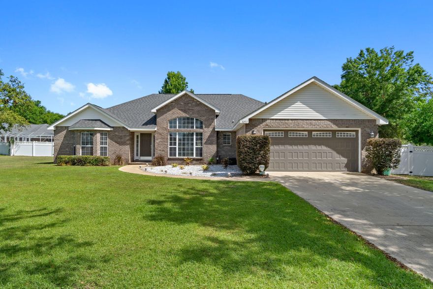 Welcome home to this stunning custom 4 bedroom/2 bath home located on almost half an acre with no HOA! Have peace of mind with a roof and HVAC both recently replaced in 2023! Pull into the long driveway and appreciate the well cared for landscaping and lovely brick exterior, and inside you'll love the grand entrance boasting high ceilings and an open floor plan. The formal dining room is a beautiful space with a reverse trey ceiling with accent lighting, crown molding, and soaring windows providing tons of natural lighting. You'll also love the hard surface flooring that extends throughout other than carpet in the bedrooms. The spacious living room is adorned with a vaulted ceiling and a fireplace with double doors to the outside. The kitchen showcases an eat in area and gorgeous custom wood cabinetry with a hop up bar, kitchen island, stainless steel appliances (including a gas range!), recessed lighting, and Corian countertops. The kitchen leads to the large interior laundry room with a pantry and additional cabinetry, with a door that leads to the two car garage. The master suite is a relaxing oasis with double vanities, a garden jetted tub, separate shower, and two walk in closets. The split floor plan features three additional bedrooms with nice sized closet space on the other side of the house with another full bathroom. Prepare to fall in love with the outside where you'll find a great sized covered back patio complete with a newly refurbished custom brick outdoor kitchen complete with a gas grill and sink, as well as a matching brick gas fire pit. The backyard is enclosed with white vinyl fencing and includes a sprinkler system on a well as well as a new outdoor 12x24 storage building. There is a whole home generator as well as an 8 camera security system that will convey (additional Acadian System will not convey). Enjoy being minutes from Publix, restaurants, banks, schools, Twin Hills Park, and the Emerald Coast Zoo!