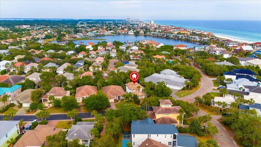 PROVEN RENTAL HISTORY! BRING AN OFFER! Located in Destiny West, one of the most sought-after neighborhoods in Destin, this gorgeous villa offers an unmatched level of luxury. With 5 bedrooms and 3 baths, a Chef's kitchen, screened-in lanai, separate guest house, and a fire pit, you and your guests will enjoy every inch of the 2287 square feet of space.Enter through the stunning double doors, and you will notice an open family room with 18-foot ceilings and a spectacular river rock fireplace. The great room opens into a dining area with seating for 8 and continues into a kitchen that anyone would be thrilled to cook in. With stainless steel Viking appliances, a gas range, oversized refrigerator, incredible storage in the shaker cabinets and pantry, a bar-height counter area, and even a wine fridge, you'll enjoy preparing meals and entertaining in this space.

Just off the kitchen are one of three bathrooms as well as a laundry room with a full-sized washer and dryer. The primary bedroom is also located on the main level with the same stunning flooring as the great room, as well as a private entrance to the pool area. The ensuite boasts a walk-in closet, double vanity, and a custom, over-sized shower ensuring that everyone has plenty of room to clean up after a day at the beach or to get ready for a night on the town.

Take the wrought-iron banister staircase up to the second floor, and you'll find three spacious and comfortable bedrooms and another full bath with a double vanity. One of the bedrooms has a set of bunk beds as well as a queen sized, providing a great space for your kiddos or teenagers to enjoy.

An extravagant oasis awaits just outside of this gorgeous house. Custom wooden gates provide privacy, and a cobblestone walk from the entrance leads to a backyard like no other. Just off the patio area, the heated and cooled "cabana" room can be used as another bedroom or as a living space. 

The screened-in lanai and pool allows your guests to enjoy the beauty of the outdoors free from pests, and you'll see ample seating whether for relaxing or dining. Finally, enjoy the fire pit any time of year, and relish in the lush landscaping all around.
Destiny West is a gated community offering access to the beach and amenities including a pool, hot tub, exercise room, clubhouse, and both tennis and pickleball courts.  Hop in your golf cart and cruise over to the Crab Trap, Captain Dave's, or Pompano Joe's for food and fun - all are less than a mile away! 

Whether you're looking for a permanent residence, a lucrative investment property, or a second home for your family's vacations, this is truly your picture-perfect paradise!