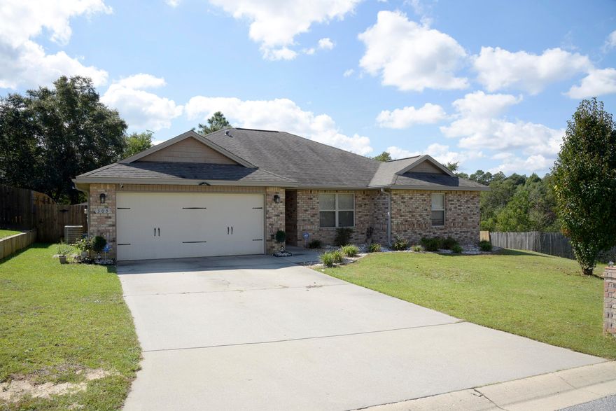 PRICE REDUCTION! Lovely home in northeast Crestview's Trailwoods Estates neighborhood. The home has a SolarEdge energy system installed at a cost of over $30,000 that may save you up to 70% on your monthly electric bill! Plus, the system is completely paid for and the solar panels are not visible from the front of the home! 4 bedrooms, 2 baths and an open living area with a double tray ceiling  provide a spacious feeling. Beautiful kitchen with custom cabinets, granite countertops, long breakfast bar and stainless steel appliances and roomy adjoining eating area are yours! Lovely master suite with walk in closet, master bath with separate shower, garden tub, double vanity and granite counter tops. Recessed lighting in some areas and a neutral paint scheme make this home very inviting.