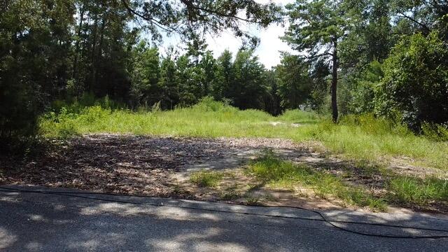 UNDER CONTRACT WITH 72 HOUR KICKOUT CLAUSE. Cleared, buildable lot near 98 and East Bay Blvd. **Must See*** lot with location that has convenient access to EVERYTHING including great schools, shopping, groceries, military bases, medical and less than 10 minutes from famous, beautiful Navarre, FL beaches. Lot is high, dry with no wetlands. Lot previously had a mobile home. Water and sewer are in place with a power pole at the corner of the lot. Turnkey lot for a mobile home or framed construction.