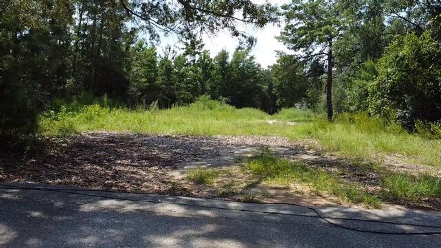 UNDER CONTRACT WITH 72 HOUR KICKOUT CLAUSE.  Cleared, buildable lot near 98 and East Bay Blvd. **Must See*** lot with location that has convenient access to EVERYTHING including great schools, shopping, groceries, military bases, medical and less than 10 minutes from famous, beautiful Navarre, FL beaches. Lot is high, dry with no wetlands. Lot previously had a mobile home. Water and sewer are in place with a power pole at the corner of the lot. Turnkey lot for a mobile home or framed construction.