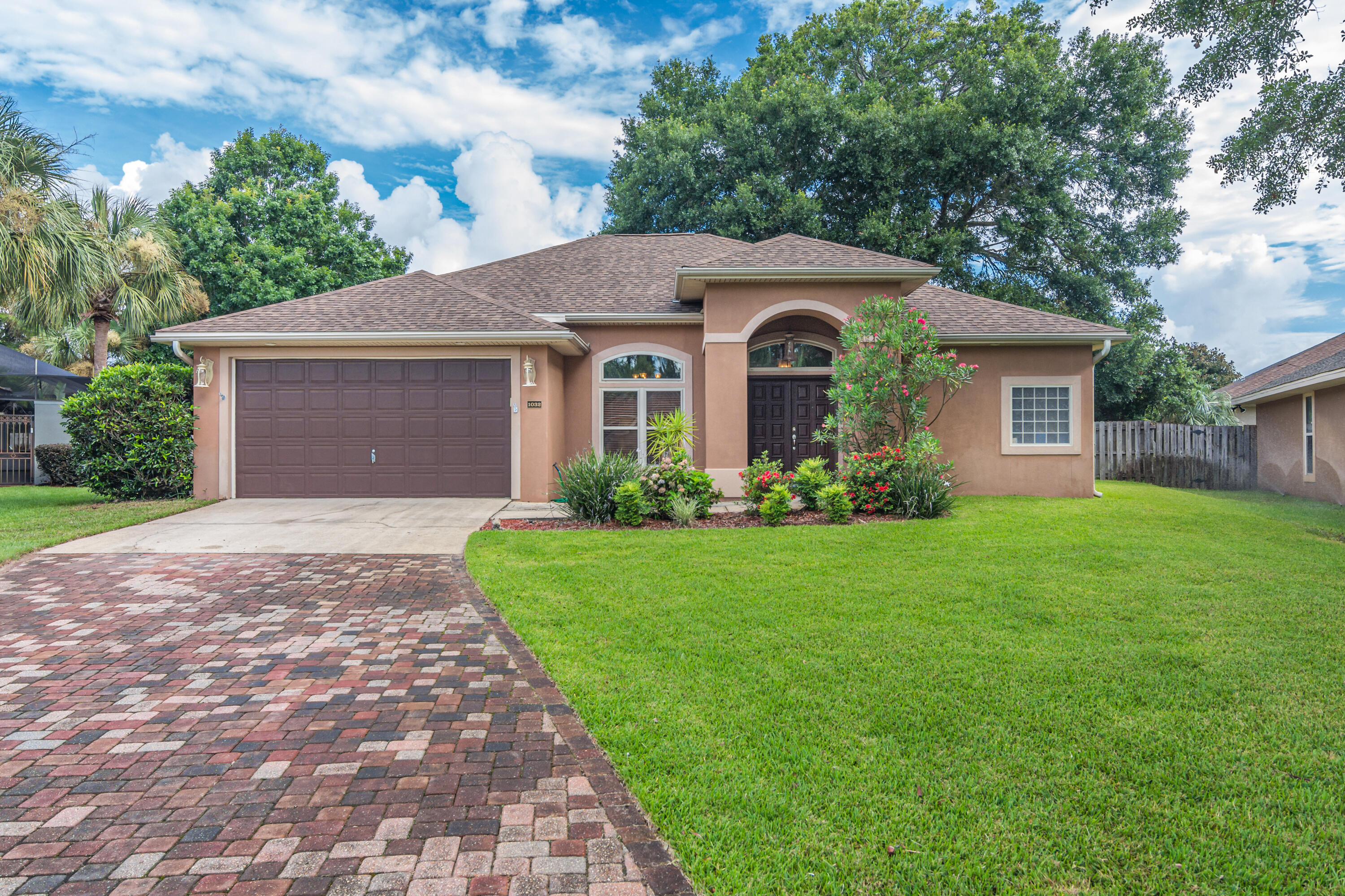 Welcome HOME! This fabulous split floor plan welcomes you in style with 11' ceilings, living room, dining room, family room, breakfast area and breakfast bar. Both living areas open to covered porch and fenced back yard. Gorgeous NEW kitchen features frosted doors on top cabinets, stunning granite, stainless refrigerator, gas cooktop, microwave hood, dishwasher, built in oven, breakfast bar and eat in dining area. Spacious master suite opens to patio, and offers large walk in closet, double vanity, whirlpool tub and separate shower. Located just minutes from the world's most beautiful beaches.