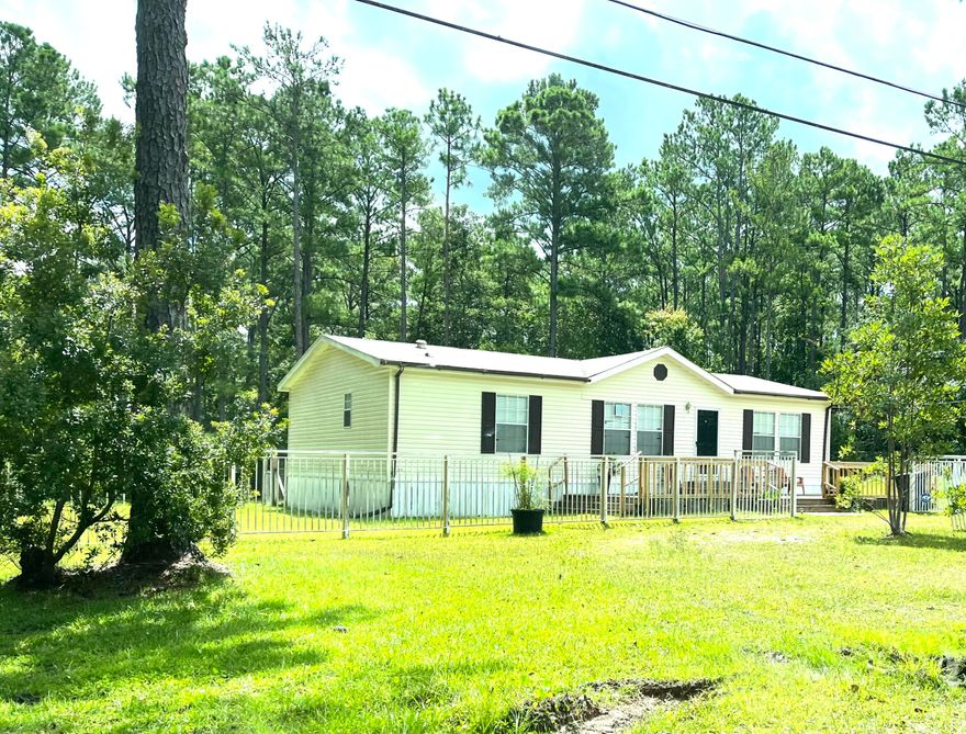 Acreage close to Town! 4.5 miles from Freeport Publix and 17 miles from the Beach!  Nice Manufactured Home on a 3.52 acre lot.  Large storage building with roll-up door on the front and door at the back.  Also has a chicken coop!  Cleared area at the back plus wooded area. 
Must see!