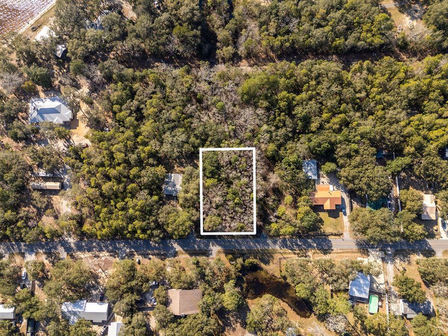 Discover the perfect spot to build your dream home! This level, nearly half-acre lot is nestled between Freeport and Niceville, offering both convenience and a peaceful setting. Enjoy the beautiful view of the bay, and the coastal breeze as you drive down Marsh Dr. to your new home.  No homeowners association (HOA) restrictions, offering a blank palette . Whether you're looking to create a private retreat or an investment property, this location provides an excellent opportunity.Don't miss this chance to own a piece of the Florida Gulf Coast!