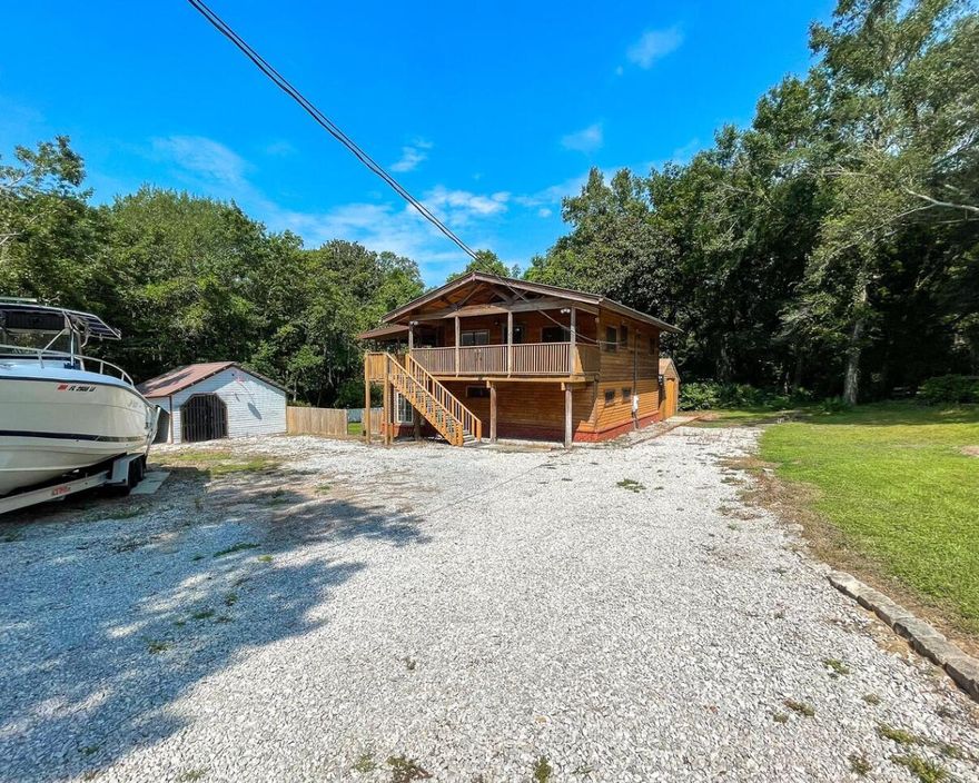 Quality craftsmanship and tasteful finishes are uniquely embodied in this 2 bedroom, 2 bathroom home. Every detail was carefully selected and quality crafted including stone accents inside the home, exposed trusses, built-in desk, cedar siding and so much more. This beautifully constructed home will exude all expectations. Located within walking distance to Choctawhatchee Bay, a short drive to beaches, Destin, shopping and dining. With nearly 1,900 sq.ft of generous living space and stylish finishes, you'll enjoy a perfect setting for relaxing and entertaining. Highlights include a detached garage, hardwood floors throughout the main living areas, a spacious workshop, HVAC installed within the last two years, hot water heater installed within one year, bonus space for gym or additional
