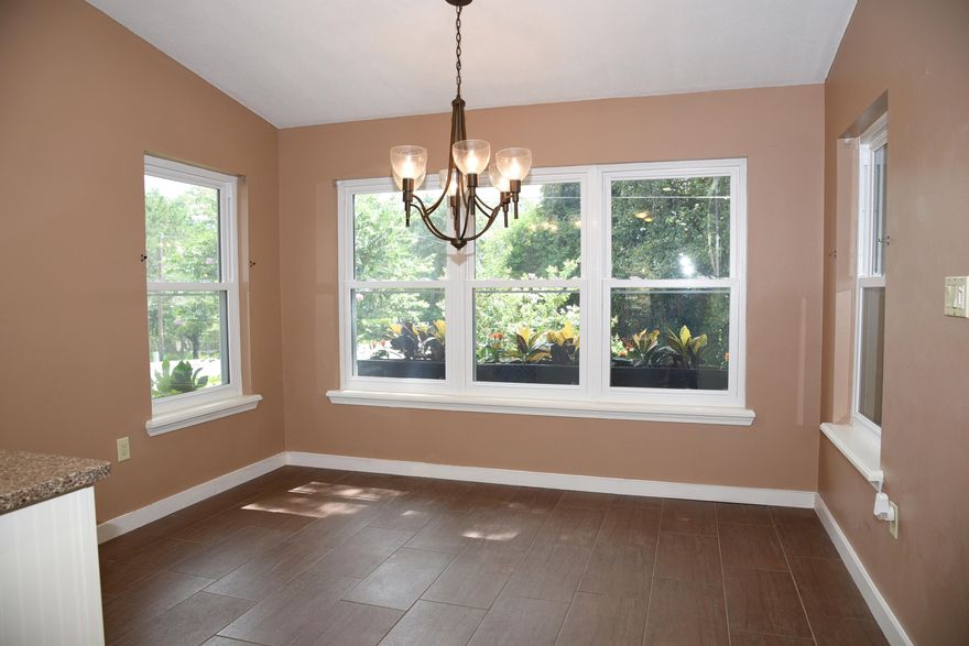 CHECK OUT THIS ONE OF A KIND HOME IN NICEVILLE, FL!!! PRICED TO SELL QUICK. This charming home features a prime location, walking distance to schools. Completely upgraded kitchen, with quartz counter tops and high-end cabinetry. 50 years metal roof. High impact windows and doors. Shutter for the front door with a hand crank to open it back up with no power. This home is perfect for entertaining, large screened-in patio with ceiling fans. Arbor w/fire-pit and exterior ceiling fan, ideal to catch breezes of the gulf.