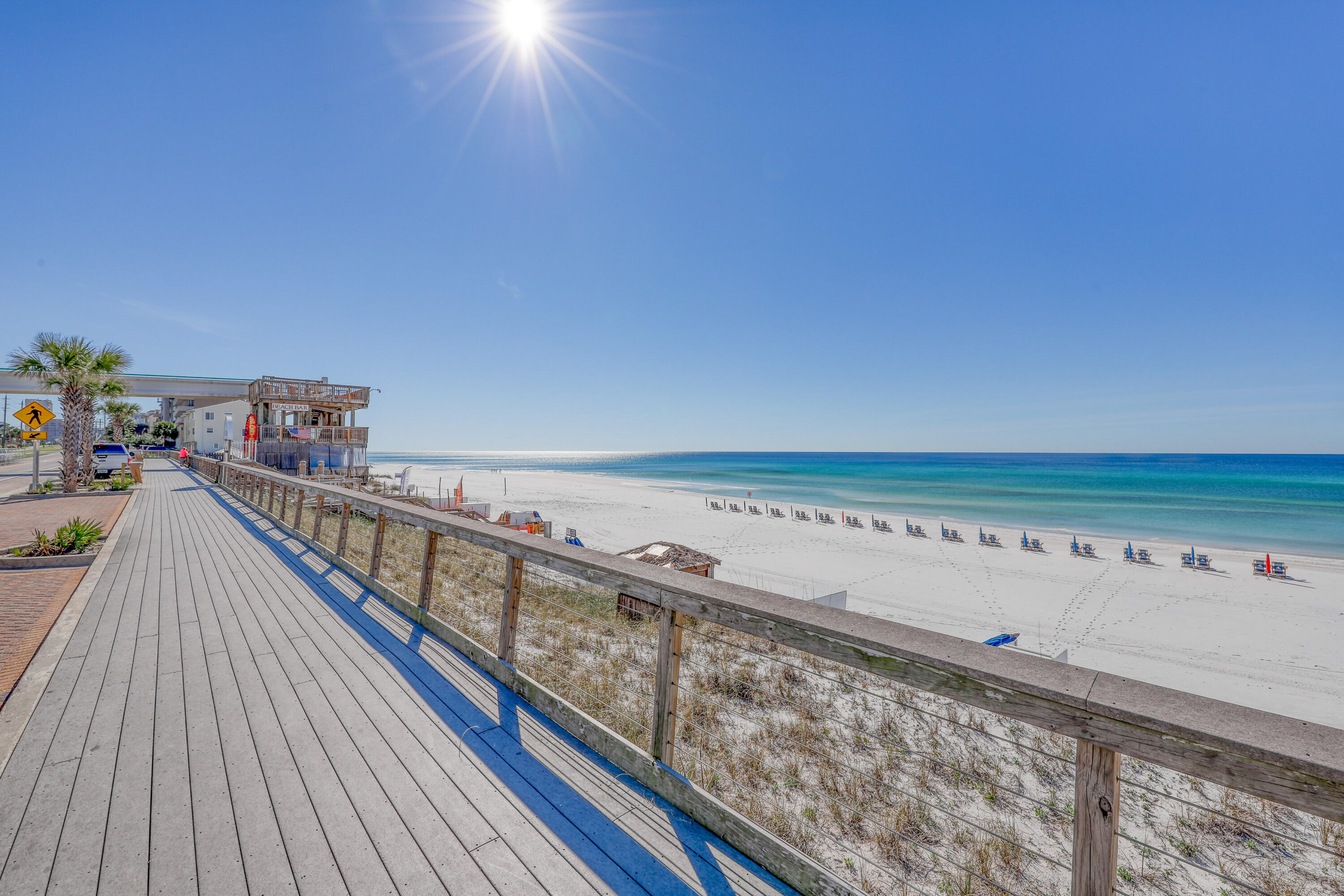 Welcome to Unit 1007 at Ariel Dunes in Seascape Resort! This beautifully updated 2BR/2BA condo offers stunning Gulf views from the 10th floor and comes fully furnished and rental-ready. The open layout features floor-to-ceiling glass doors, a spacious balcony, granite countertops, stainless appliances, and a breakfast bar. The primary suite boasts balcony access, a large en-suite with double vanities, soaking tub, and walk-in shower. Enjoy resort-style pools, fitness center, on-site dining, and private beach access--coastal living at its finest!