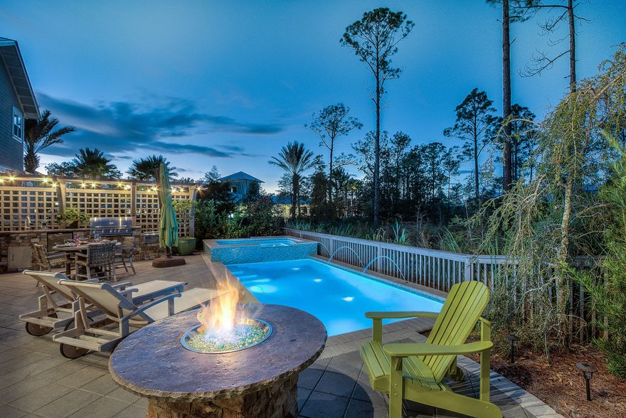 This home is a high-quality construction home in Seagrove, nestled between protected borders of the state forest and less than a mile from 30A. This spacious floorplan offers 2713 square feet, 4 bedrooms, bunk/day room, 3 bath and a POOL Upgrades galore- including site-finished pine flooring throughout home, upgraded cabinets, large island, kitchen with built in cases and wine rack, granite in kitchen and quartz in baths, Cafe SS appliances incl gas cooktop, spacious screened-in porches for outdoor entertaining, a 1-car garage, and much more!This home offers a private in ground custom hot tub and pool, summer kitchen that's equipped with sink, grill, gas burner, refrigerator, and storage. A gas fire pit sits next to the outdoor dining area. Pavers cover the pool deck. Location! Location! Location! The only home available this close to the Gathering Place and Lily Lane beach trail.  This naturally beautiful community features resort-style amenities for the entire family to enjoy. ''The Gathering Place,'' NatureWalk's amenity center will include: a resort-style beach entry pool, lap pool, children pool, play area, and a larger summer kitchen equipt with a television for game day. Also included in HOA dues is a summer shuttle to and from the beach!
