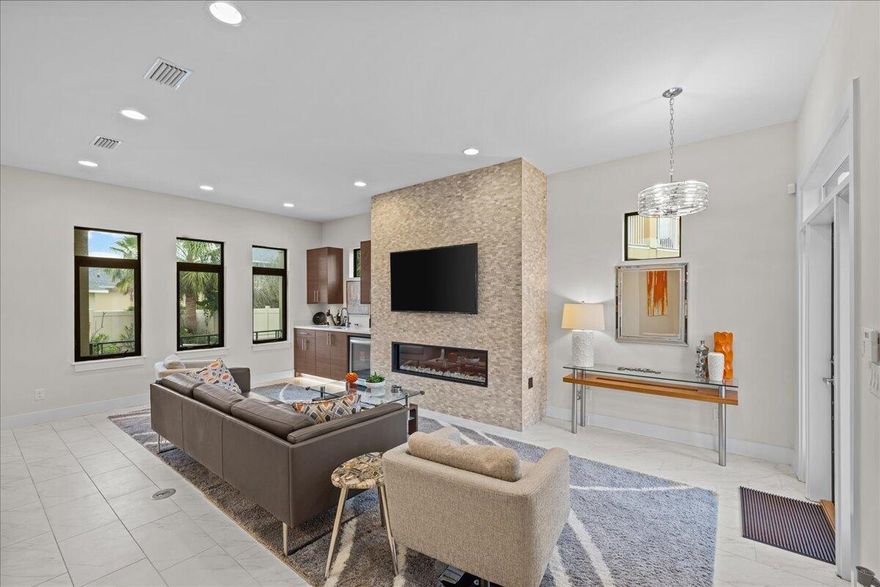 Close to Avalon's private beach, this home is a luxurious, fully furnished 5 bedroom, 5-bathroom retreat designed for relaxed Florida living. The open-concept first floor seamlessly integrates the kitchen, dining, and great room, leading to a first-floor bedroom and a view of the sparkling pool with a waterfall and a stone-tile fireplace.  The second floor features three spacious bedrooms,and a bonus room, each with en-suite baths, smart TVs, and ample closets. The master suite provides a private balcony, spa-like bath with a soaker tub, dual shower, and skylight. This tech-enabled home includes a full security system, dual AC units, and smart-controlled saltwater pool/Jacuzzi.  Community amenities include a large heated pool, tennis and pickleball courts, and a landscaped courtyard