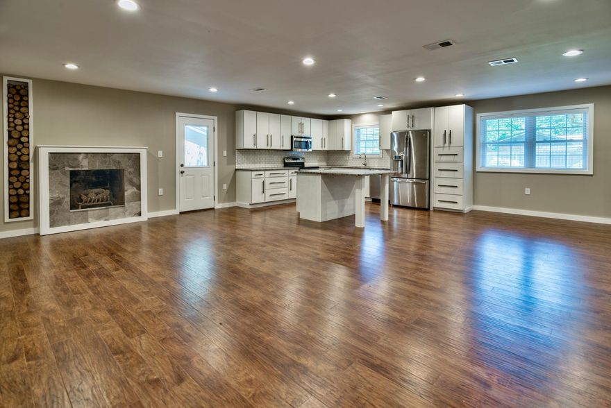 Completely renovated home. This newly remodled home shows like a new home. It has been completely renovated and features all new wood flooring, new bathrooms, and kitchen. The open kitchen features all new stainless appliances, new cabinets, granite and an over sized island. The open floor concept is great for entertaining. There is also a formal living room that opens onto a heated and cooled Florida room that overlooks the large fenced in backyard.