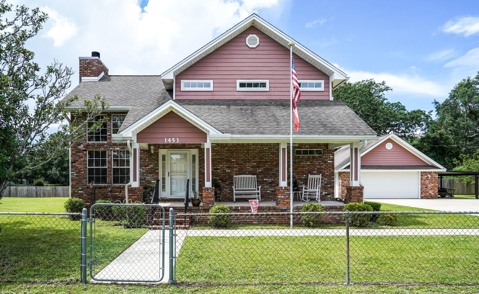 One owner, custom built home located on an awesome corner lot that is almost half an acre.  Open, bright, warm and inviting home with tons of tons of windows, oak floors throughout and the most amazing brick fireplace.  Detached 2 car garage with tons of loft storage space, a carport area, a small storage shed, green house AND a oversize out building that could be a lounge area or office.  Bring your RV or large boat.