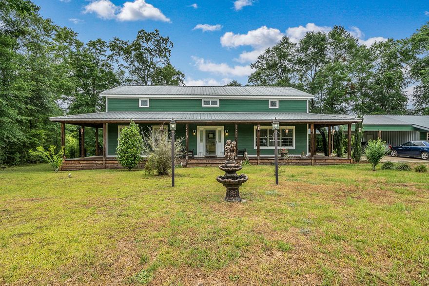COUNTRY CHARM! Are you looking to get away from it all? Here is your chance. This 3 bedroom 3.5 bath home has 2,256 sq ft plus a Bonus separate apartment all on 5 Acres of wooded bliss. So many extras: Metal roof, storm windows, Stainless Steel appliances, 3/4 inch solid Oak flooring, custom travertene tile in all wet areas, berber carpet in the bedrooms, 2 Jacuzzi tubs, 2 electric fireplaces and a security system. Oversize rooms give you lots of space to spread out. The kitchen is open to the dinning room which is large enough for those family holiday get together's. The great room has a Cathedral ceiling with an over looking loft spacious enough to allow you a lot of options for it's use. The very unique master suite has French doors opening into a gorgeous bathroom with oversize