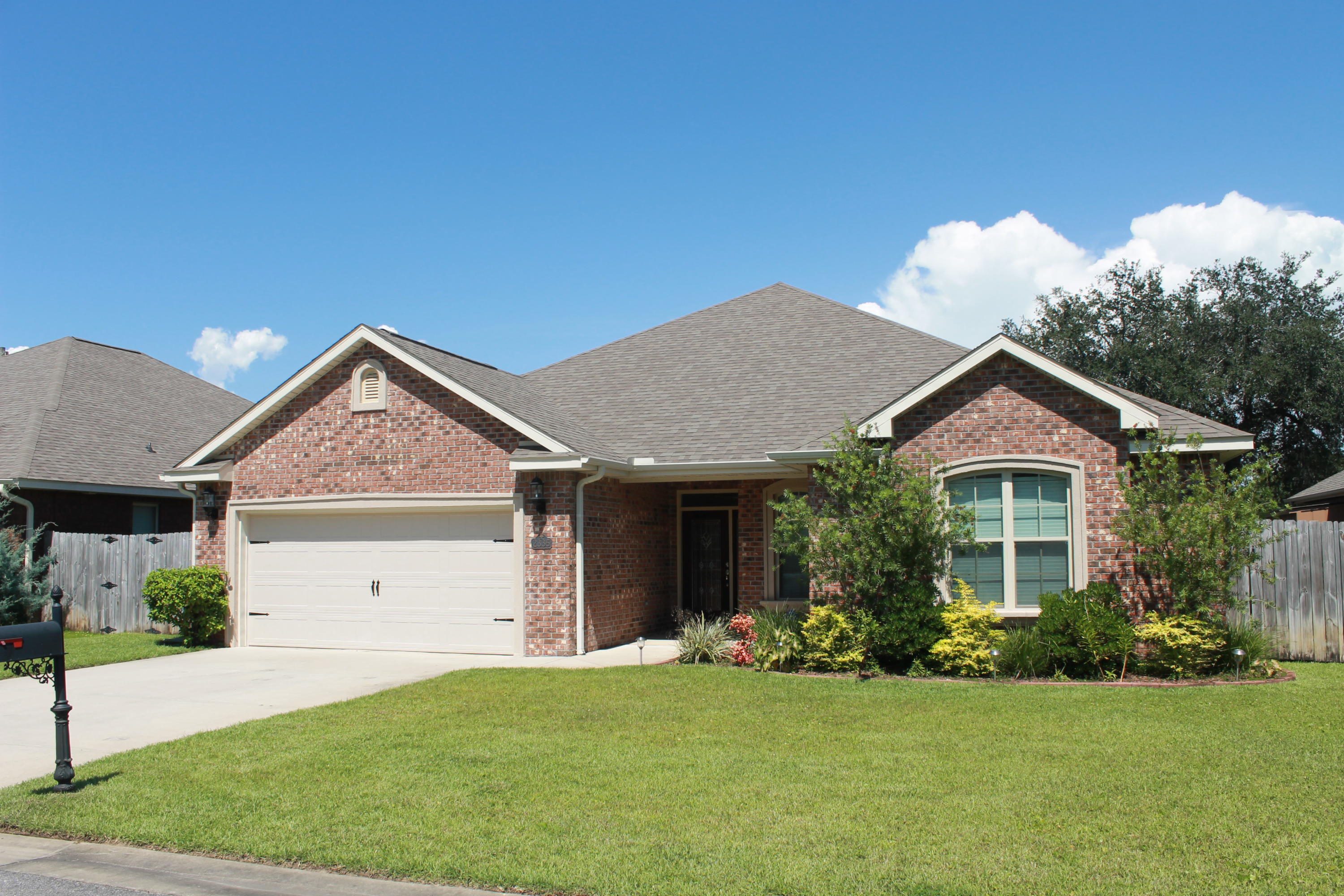AVAILABLE FOR MOVE IN- JUNE 4!You'll love this exquisite 4 bedroom, 2 bath home in the exclusive Majestic Oaks subdivision! Featuring 9' ceilings, all brick exterior, open floor plan, plus wood and tile flooring in all the main living areas. The kitchen has beautiful granite countertops, stainless steel appliances, an abundance of cabinetry, and a large breakfast bar. Retreat to the master suite where you'll find a walk-in closet, and a relaxing en-suite bathroom; featuring a split double vanity with granite countertops, seperate shower, and large soaking tub! The sodded backyard offers a privacy fence, and covered patio.Easy commute to military bases and gorgeous beaches. Small pets considered- Restrictions Apply.Call Sound Choice Real Estate to schedule a showing- 850.389.8533