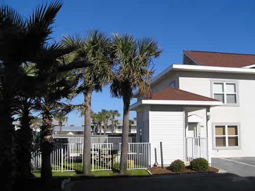 Beautifully updated kitchen with granite countertops, new appliances, and fresh paint! With coastal furnishings and dcor this unit is like a breath of fresh air. The main level features an open living, dining, and kitchen area. You'll also find a guest room, full bath, and laundry closet. The second level houses two master suites. The south master features a wet bar, plentiful closet space, and spacious bath with a double vanity, garden tub, and separate shower. Tile and wood flooring throughout make for easy maintenance. Royal Seaesta amenities include a pool, picnic and grilling area, and deeded beach access just across the street. Spend your days with your toes in the sand. Simply paradise. A great investment opportunity this unit is projected to gross up to $32k in rentals!
