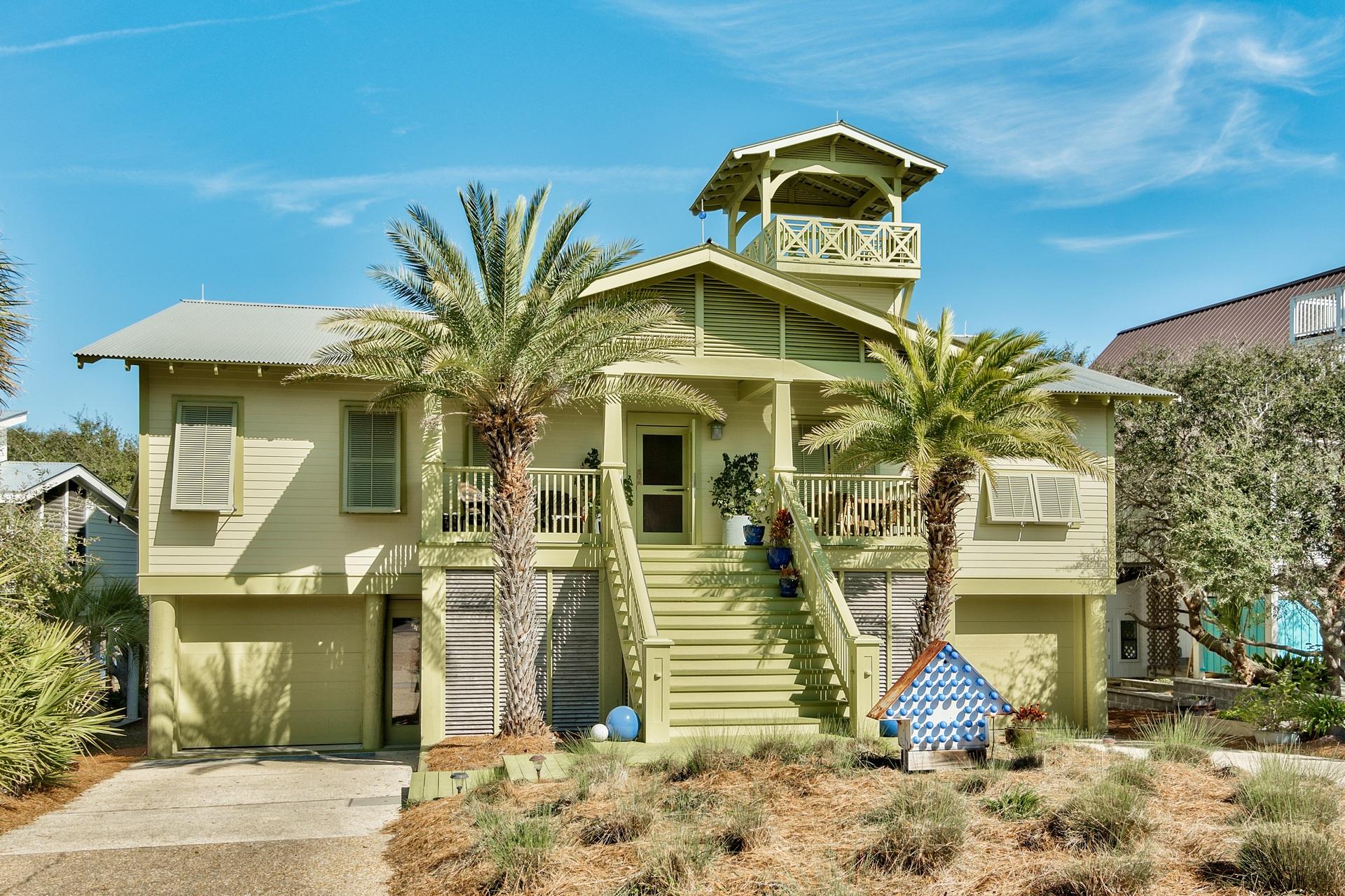 At the quiet dead end of Blue Mountain road, this unique 30A home sits on a large lot, just one row back from the wide, uncrowded area of Blue Mountain Beach. As you enter this special oasis, you see the timeless craftsmanship of this unique home that was moved to this perfect lakefront lot in 2003. Owners recently added a wonderful master suite overlooking Big Red Fish Lake, giving it the feel of a tree house with ceiling to floor windows and a fireplace for chilly winter evenings. New chef's DREAM kitchen with La Cornufe double gas stove, Carrara marble, Wolf steam convection oven, 4'Galley sink, Sub-Zero refrigerator, custom cross cut oak cabinets, all overlooking the lush large yard and tranquil waters of the Lake. Cozy breakfast nook with fireplace. 50' tower with commanding views