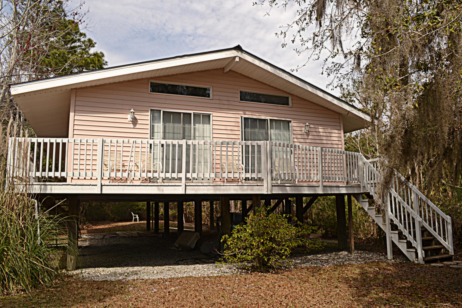Looking for your next home? LOOK NO FURTHER! This is a great house in a great location. This 2 bedroom home has tons of natural light. There is a large living room with two sliding doors that open up to the wrap around porch to let in the refreshing bay breeze. Both bedrooms are a good size and have their own 1/2 bath and share a shower/bathtub. The kitchen is spacious and opens up to the living room. This home is great for entertaining and is on 1/2 acre. Enjoy your privacy or entertain. You are 15 minutes from the beaches of the Emerald Coast. You don't want to miss this opportunity!