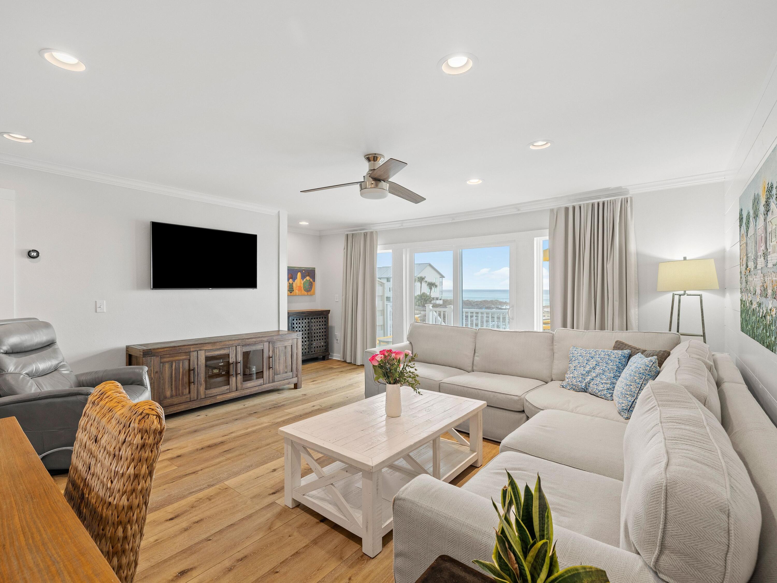 Welcome to your dream coastal retreat in the heart of Seagrove Beach! New flooring adds a contemporary ambiance throughout, along with stylish new furniture from Pottery Barn. Shaded parking is offered on the ground floor, with two additional floors of accommodation offering exceptional beachfront living. The updated kitchen is spacious and well-appointed, with new cabinets, a custom pantry, sleek quartz countertops and a matching tile backsplash. A full complement of new stainless steel appliances makes this a well-equipped space for preparing snacks and meals. Dine indoors at the dining table or out on the deck in the fresh sea air. The beautiful living room has custom shiplap detail. Blackout drapes and a new wall-mounted TV provide a home cinema experience for enjoying your favorite movies and sports. Sliding doors offer impressive dune and beach views from the living room, dining room and kitchen. Step outside onto the updated deck and relax on new polywood furniture with Sunbrella cushions. It's the perfect place to lounge and take life easy. If you fancy a stroll or a swim, access to the white sandy beach is just a short walk away. You're sure to get a good night's sleep in the primary suite, which includes a new Westin Heavenly bed. Fresh paint, a custom closet and a private bathroom with a frameless shower are just some of the upgrades that make this a delightful, tranquil sanctuary. Sliding doors provide stunning beach and gulf views and direct access to the upper balcony. The guest bedroom is ideal for families. It also had a recent facelift with new furniture, including a queen-size Westin Heavenly bed, built-in bunks and a wall-mounted TV. The redesigned ensuite bathroom has a smart tub/shower combo. The home also has a half bath and exceptional storage that includes three dedicated owner's storage closets. A second laundry room with a washer and dryer makes good use of the under-stairs space. Along with a new roof, installed in February 2025, this beach house has a new HVAC and water heater, making it turnkey ready for the future owners, available for conventional financing.