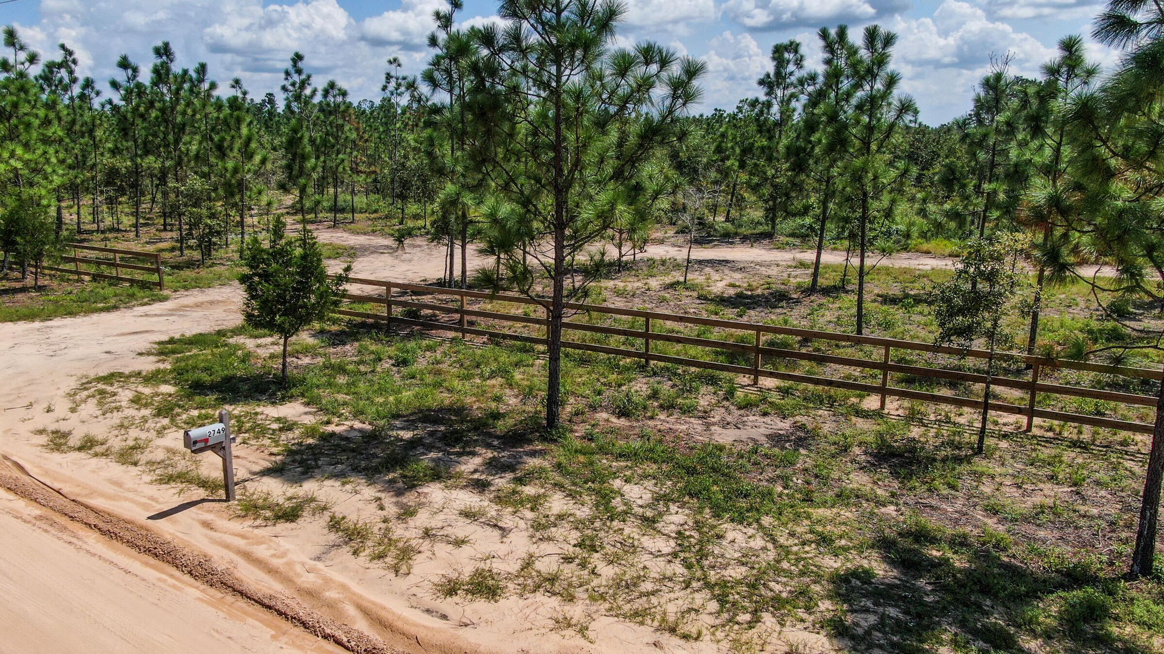 Please view to appreciate! Home site is cleared and ready to build your dream home! Current owner can build your dream house with your plans or he has 10 floor plans you can choose from 1500 square feet to 2700 square feet. Either way build your dream home or enjoy having a 10 acre get away with RV hook up and use the newly installed septic tank as a dump station. The owner has also added underground power with 50/30 Amp RV service on this beautiful fenced lot. Grow a fantastic vegetable garden utilizing the new 400 foot well! Property also has a fresh water spring that has great possibilities such as creating your very own fish pond or swimming hole. Owner has additional lot available, separate sale, in Compass Lake. Call David Shearon for any additional information. Do not miss out!
