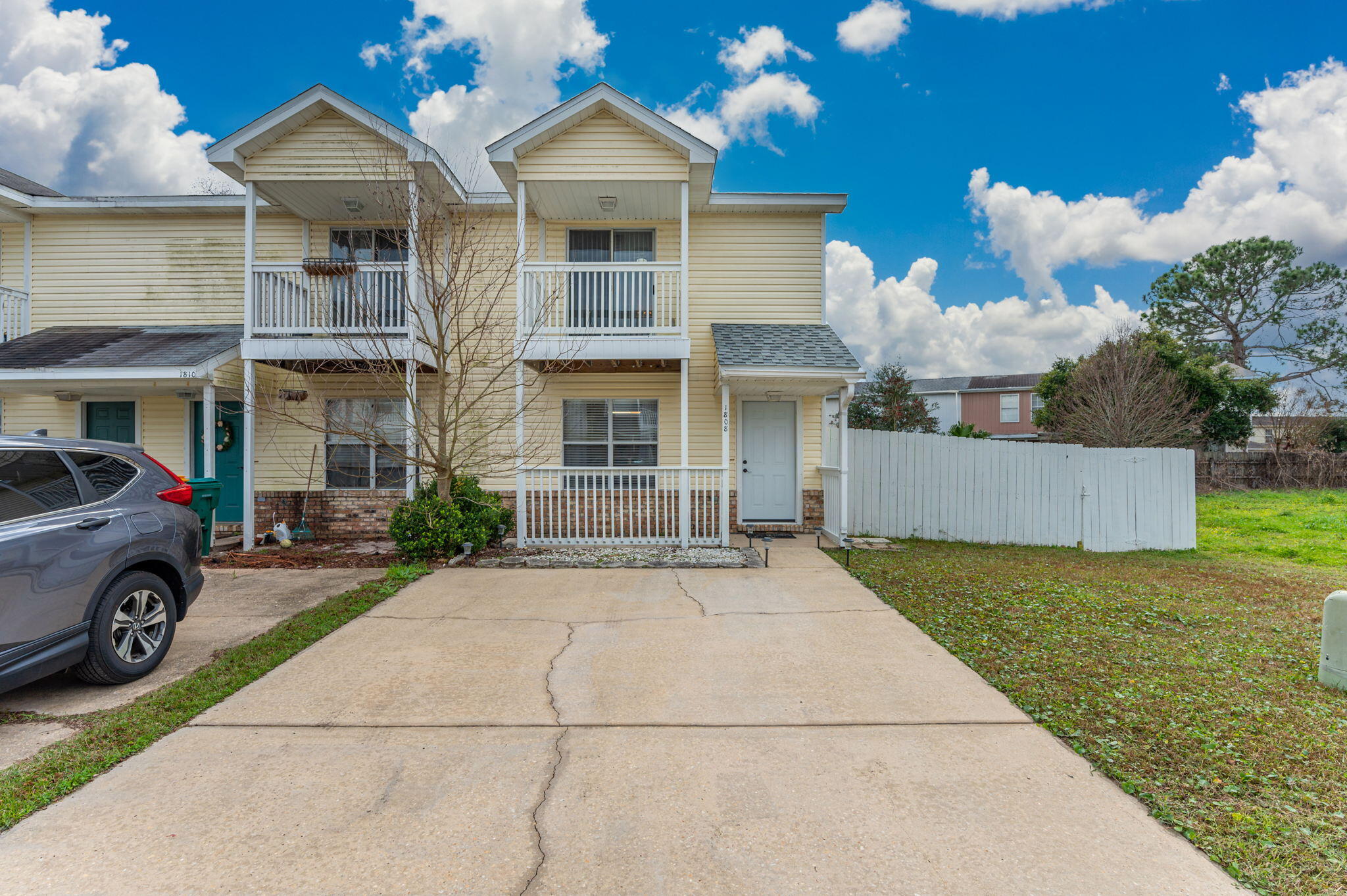 Adorable and spacious end-unit townhome only minutes from Hulburt and Eglin! Open floorplan with large kitchen and tons of natural light. Indoor laundry right off the kitchen, two big bedrooms with en-suites. Including one with a private balcony. Dining and half-bath downstairs complement the downstairs. Huge lot, with the backyard fully fenced in! Unit is located at the end of the street, in a cul-d-sac. AC is 2013, Roof is 2020.