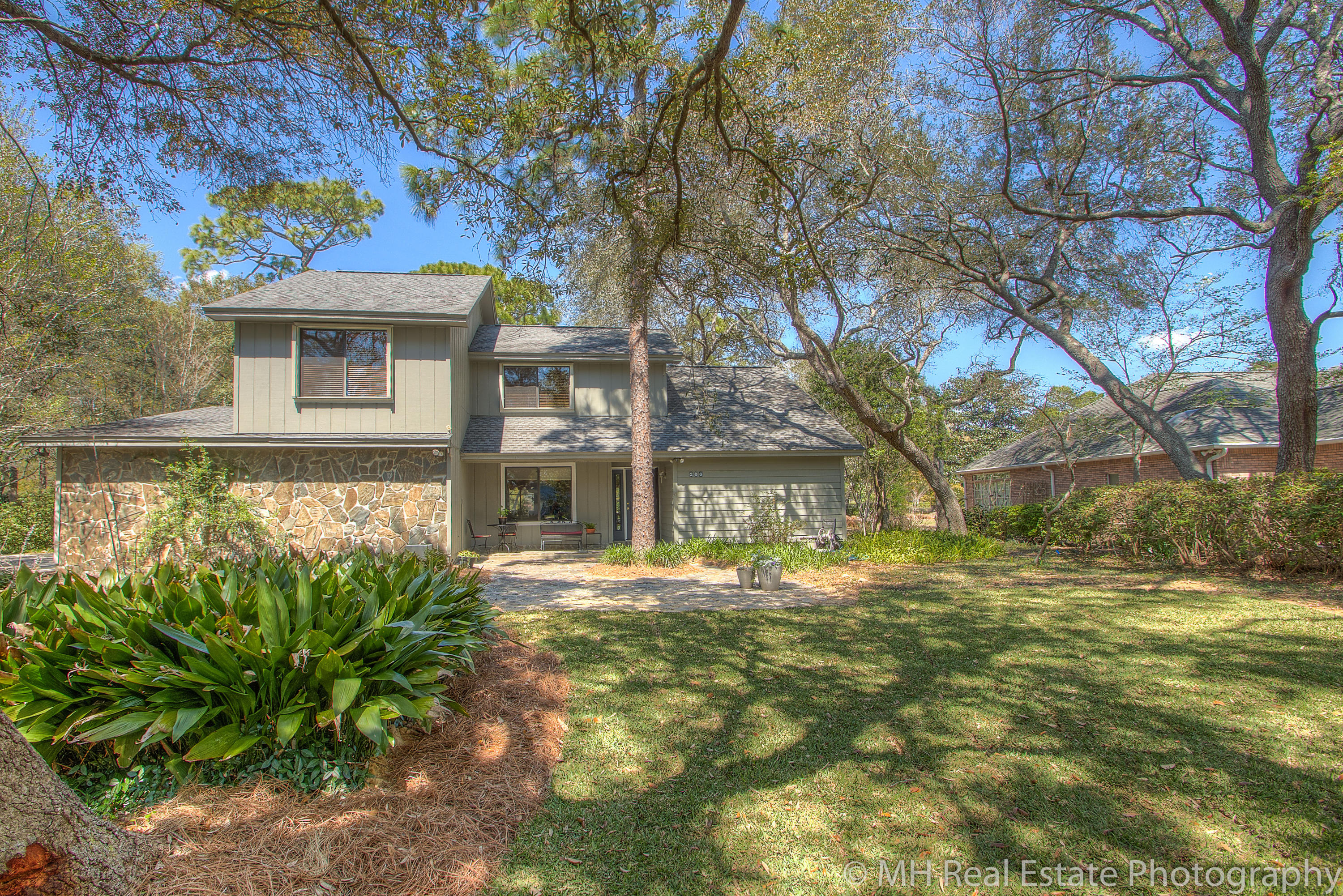 This home is on the heart of Niceville! New development abounds all around. 206 Ruckel is nestled in a tree-lined, almost half acre lot, with paver driveway leading to the 2 car garage. This home has a fantastic front porch overlooking the newly sodded front yard. Inside there is a large open living room with vaulted ceiling, stone fireplace, a guest half bath and french doors to the covered porch. The master bedroom is on the first floor, with its own en suite which comes with dual sinks, jetted tub, separate shower and toilet, and walk in closet. On the opposite side of the house, you will find the renovated kitchen with Silestone counter tops, newer appliances and a beautiful cabinetry. Just off the kitchen is the entrance to the garage, side entry to the home, and laundry room. More.. From the kitchen there is a back staircase leading upstairs where you will find 2 bedrooms with an adjoining bathroom, fantastic walk-in shower, and ample cabinetry for linens and toiletries. In the middle of the home on the second floor is a large second living space, great for a play room, den, game room, home school space, etc. There is a closet as well as cabinetry, sink and space for a soda fridge and popcorn bar! Opposite the two additional bedrooms is an office space which could be converted to a fourth bedroom by making the attic closet into a bedroom closet. Please open the attic door to see the ample storage space available in this home. The roof was replaced in 2009, and the home has a gas tank less water heater!!