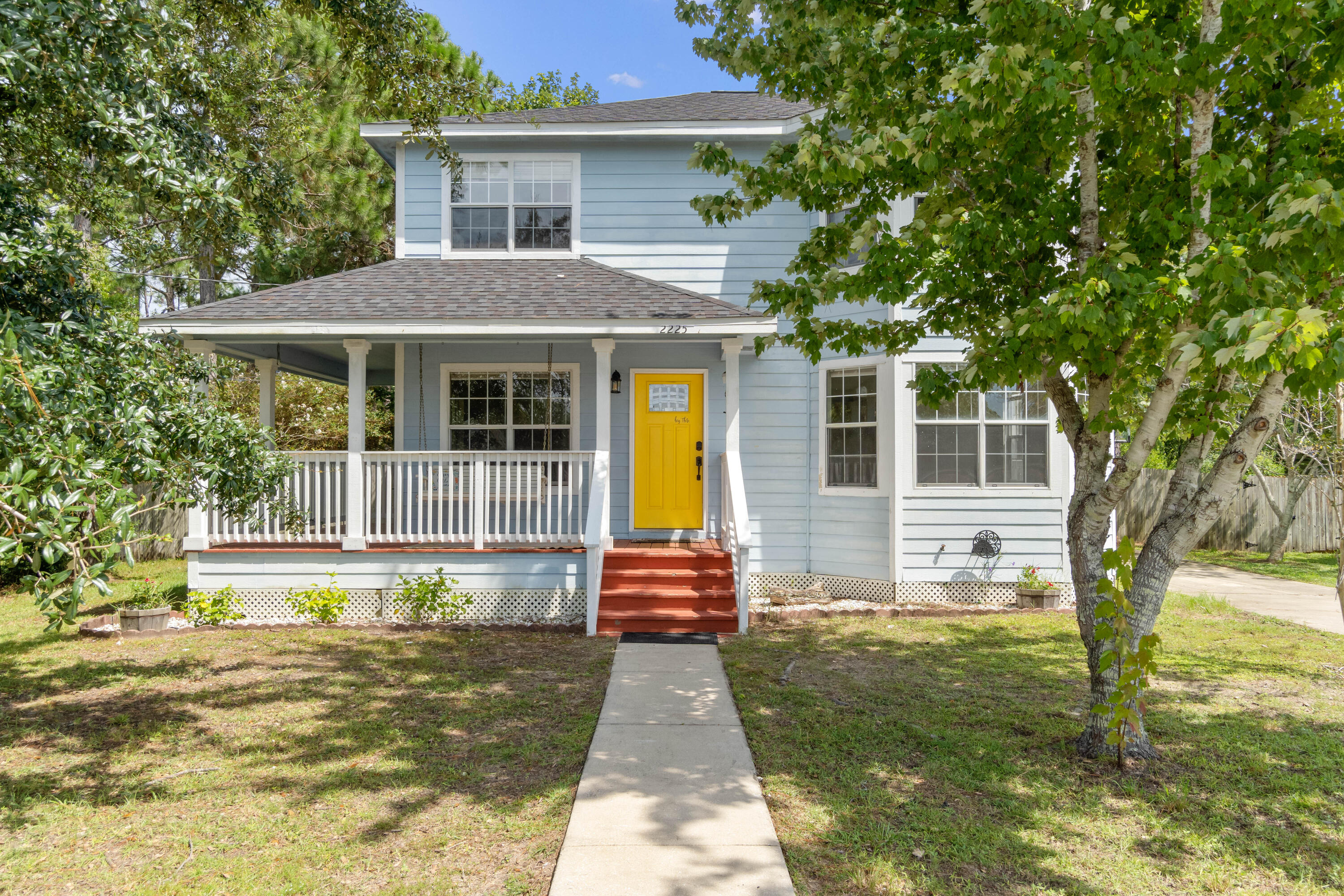 Location, Location, Location!!!!  This Southern charming Victorian style home has a wraparound porch with a swing calling your name  to relax on.  This home is close to shopping, beautiful Navarre Beach and Hurlburt Field.  Once you open the door, you will notice the beautiful brand-new luxury vinyl wood floors complimenting a natural fireplace to keep you warm during those colder nights.  This 3 bedroom, 2.5 bath home with an upgraded kitchen is a chef's dream with a built-in pantry, stainless steel Panasonic appliances, new cabinets, counters and backsplash.  Sitting on almost a half of acre on a very quiet street, this home's roof is only 2 years old.  Right outside the screened back porch, there is a pergola, firepit, and shed for your tools. The schools are within walking distance.