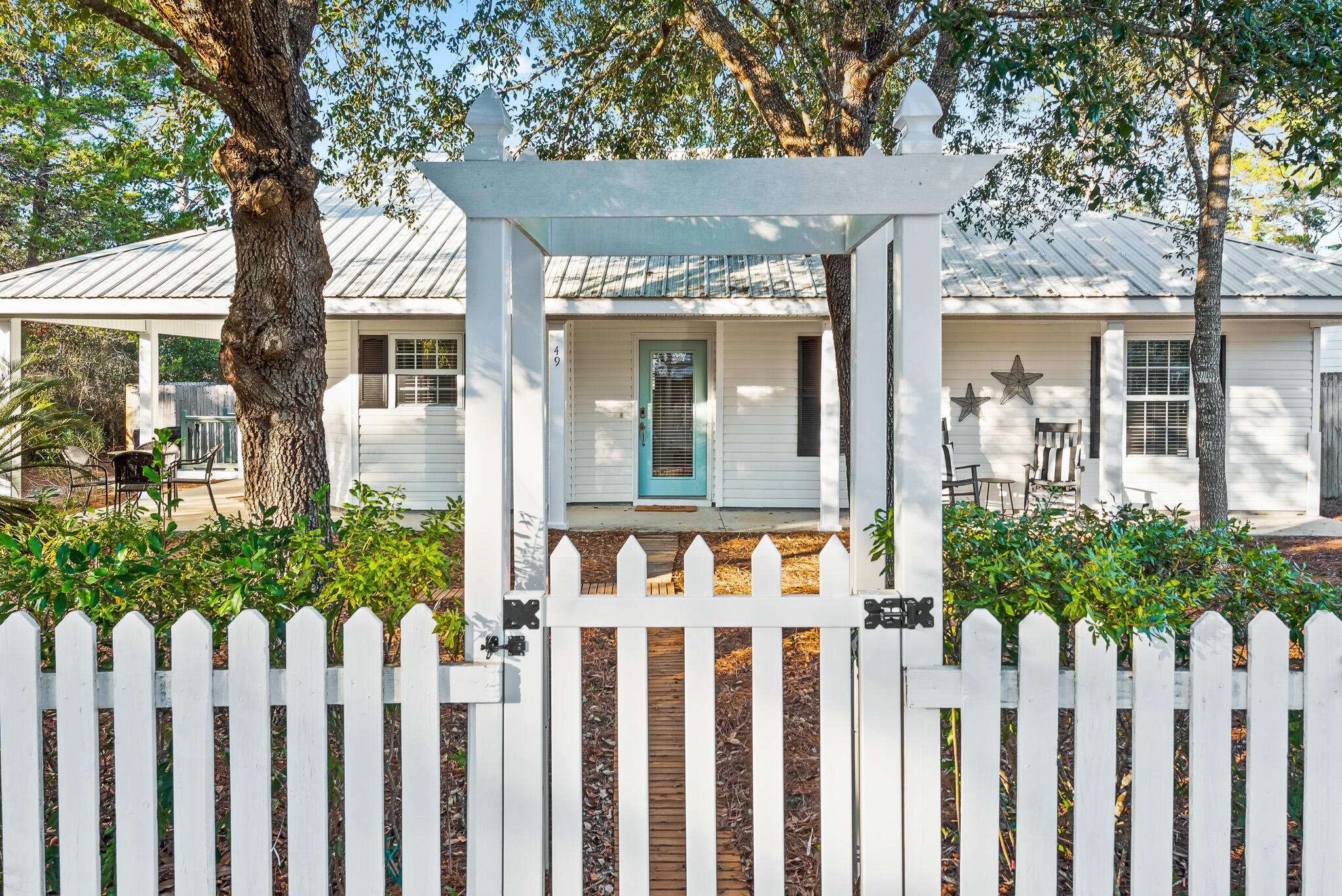 Investor alert! If you're looking for a true unicorn investment property with the ultimate private pool, backyard oasis and more than $87K in rentals on the books for 2023, look no farther than 49 Ash Street in Gulfview Heights on the west end of 30A. Nestled on a quiet street in a non-HOA community, this newly remodeled, turnkey beach cottage features a stunning backyard with a brand new 26x14 private pool perfectly situated on an oversized lot in one of the most popular neighborhoods on the west end of 30A. Designed with vacation rentals in mind, this charming three bedroom/two bath beach cottage features all new kitchen appliances (2021), hot water heater (2019), HVAC (2021) washer & dryer (2022), new 26 x 14 pool w/ sun ledge, heat pump (2023), new vinyl fence (2023) and landscaping. The master ensuite bedroom is spacious with new slider doors that lead to a private patio overlooking the backyard. The open concept living space with cozy fireplace and updated kitchen are perfect for lounging and entertaining multi-generations of family and friends. Two additional guest bedrooms, including a whimsical bunk room, and second full bath complete the interior space. Located only three short blocks to the beach and an easy golf cart or bike ride to popular 30A restaurants including at Shunk Gulley and Gulf Place. Gulfview Heights is one of the most popular neighborhoods on the burgeoning west end of 30A with no HOA and no short-term rental restrictions. With close beach access, incredible rental production and a charming backyard oasis, this is the perfect income producing property for your investment portfolio. This property is a popular vacation rental and available to show only on turn days. 