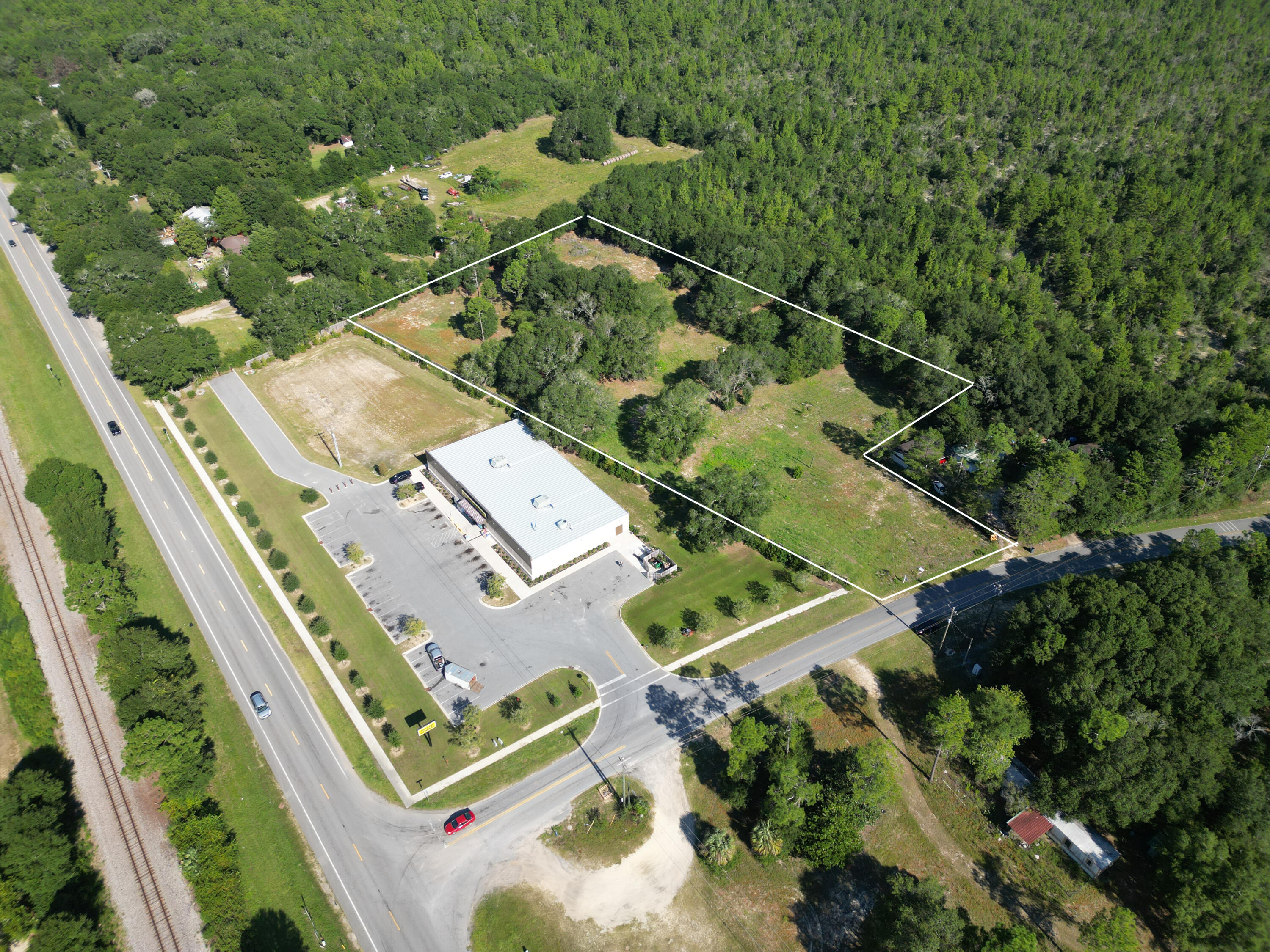 Positioned just off Highway 90 at Kings Lake Road, this 3.4-acre parcel offers exceptional visibility and accessibility in a growing area of DeFuniak Springs. Zoned General Commercial, the property is ideally suited for a wide variety of business ventures, from retail and service establishments to professional offices.Located directly next door to Dollar General, the site benefits from strong traffic flow and established neighboring businesses, creating built-in visibility for future development. With its generous size, cleared land, and easy access to major thoroughfares, this property is ready for your vision. Whether you're looking to expand your business presence or develop an investment property, this prime commercial tract provides a rare opportunity to build in one of Walton County's most promising locations.