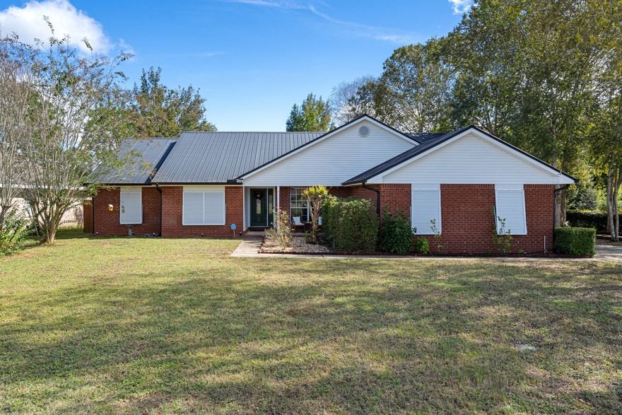 This stunning lakefront home in Cherokee Bend of South Crestview sits proudly on a large corner lot in a quiet cul-de-sac. Inside, you'll find 4 bedrooms, 2 bathrooms, and 2,257 sq ft of beautifully maintained living space -- including a formal dining room, a flexible office or gym, and tile flooring throughout with carpet only in two bedroomsThe kitchen shines with granite countertops and stainless steel appliances. Step outside to your fully fenced backyard and enjoy peaceful sunsets over the lake.Additional features include black gutters, a 2005 black metal roof, 2016 HVAC, and a 2019 gas water heater. All this with a low $121/year HOA.