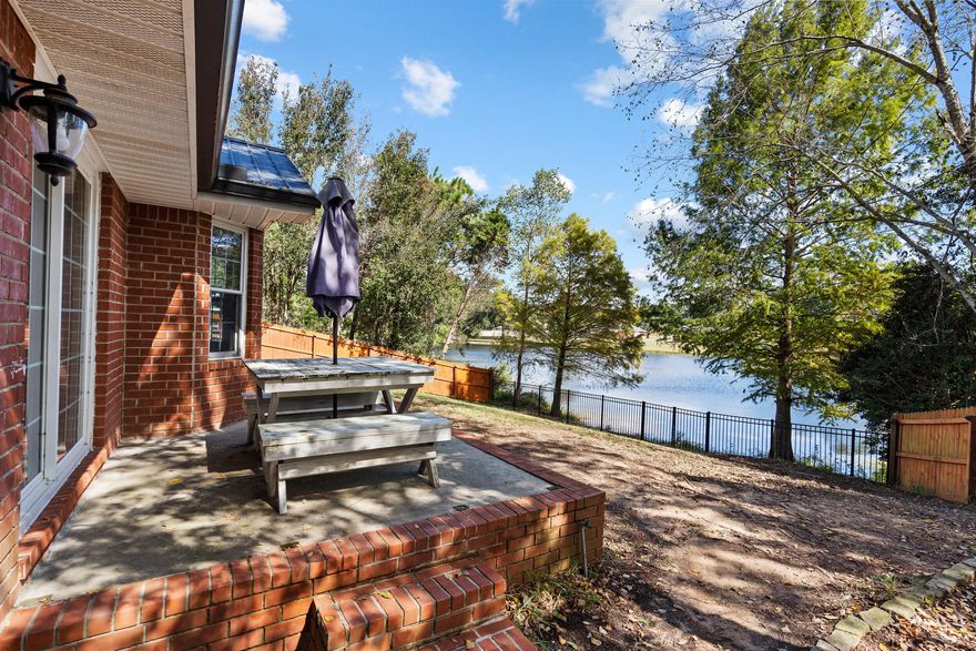 This stunning lakefront home in Cherokee Bend of South Crestview sits proudly on a large corner lot in a quiet cul-de-sac. Inside, you'll find 4 bedrooms, 2 bathrooms, and 2,257 sq ft of beautifully maintained living space -- including a formal dining room, a flexible office or gym, and tile flooring throughout with carpet only in two bedroomsThe kitchen shines with granite countertops and stainless steel appliances. Step outside to your fully fenced backyard and enjoy peaceful sunsets over the lake.Additional features include black gutters, a 2005 black metal roof, 2016 HVAC, and a 2019 gas water heater. All this with a low $121/year HOA.